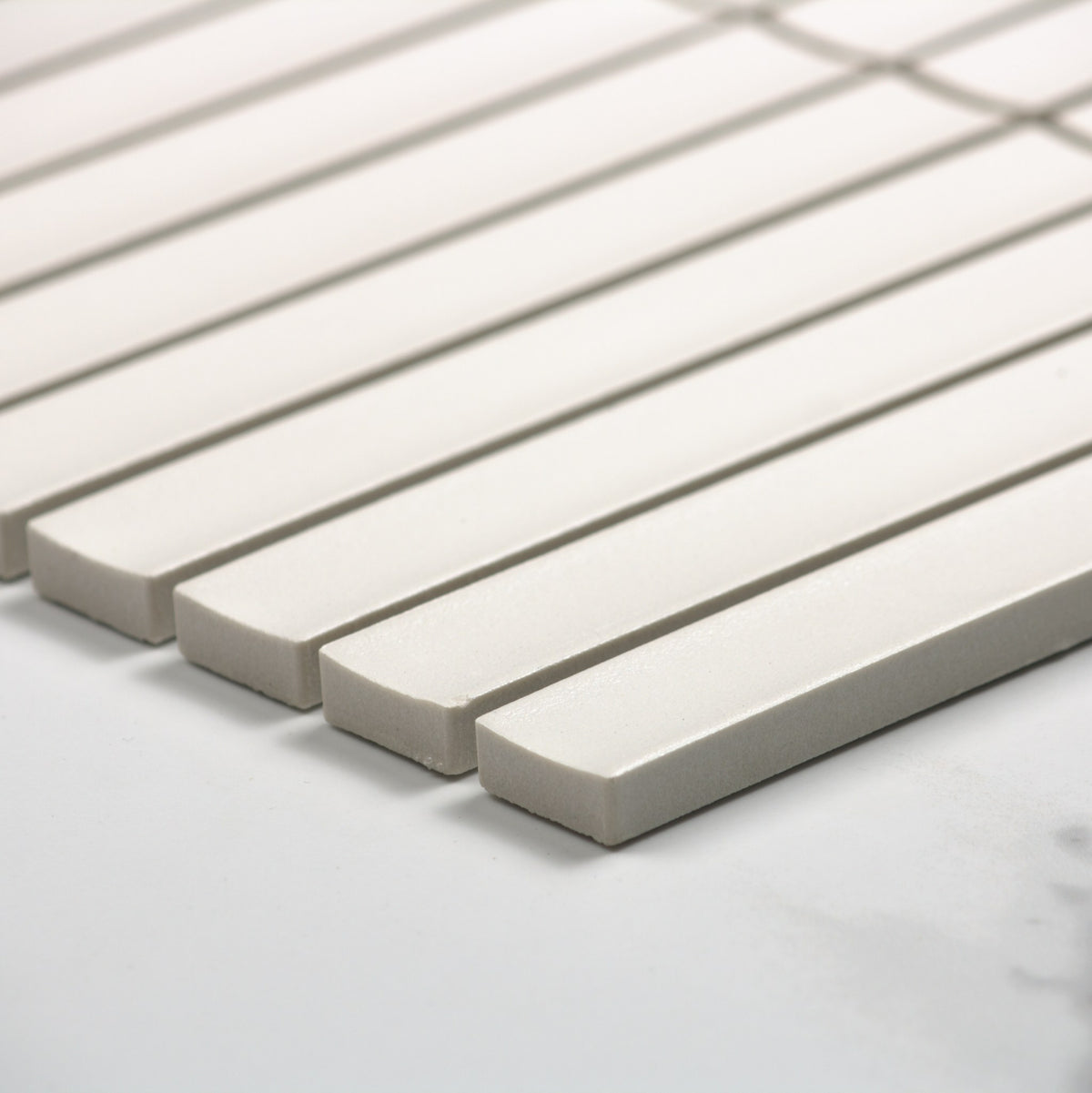 Marlowe Porcelain White Concave Speckled Matt Rectangle 20x145mm angle view