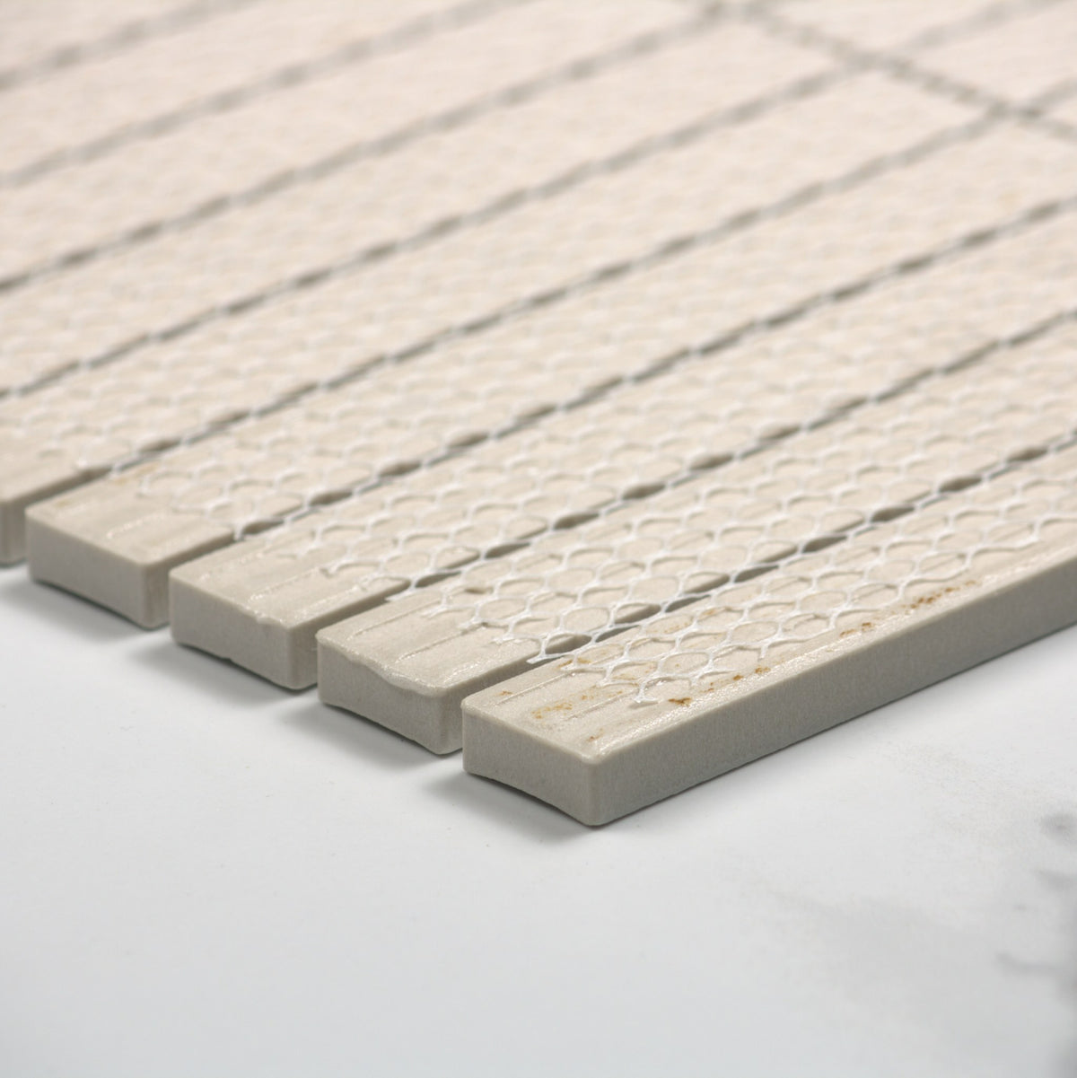 Marlowe Porcelain White Concave Speckled Matt Rectangle 20x145mm angle view