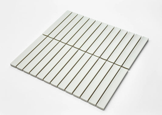 Pack shot of Marlowe Porcelain White Concave Speckled Matt Rectangle 20x145mm tiles arranged in a flat lay grid showing their slim rectangular shape and soft white matt finish.