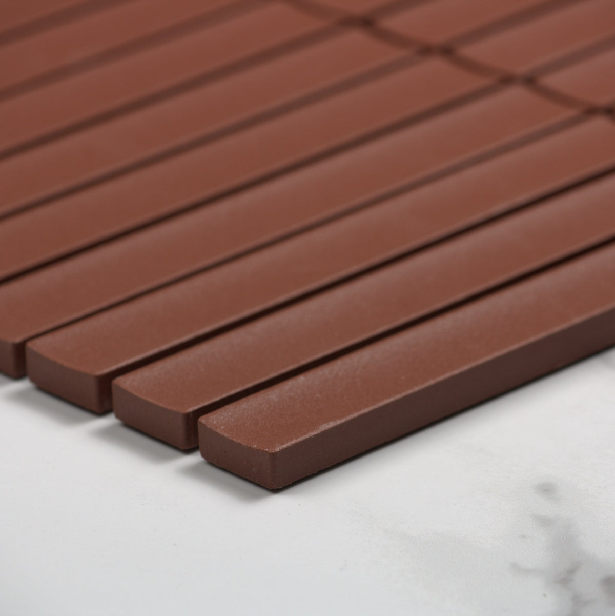 Marlowe Terracotta Concave Speckled Matt Rectangle 20x145mm angle view