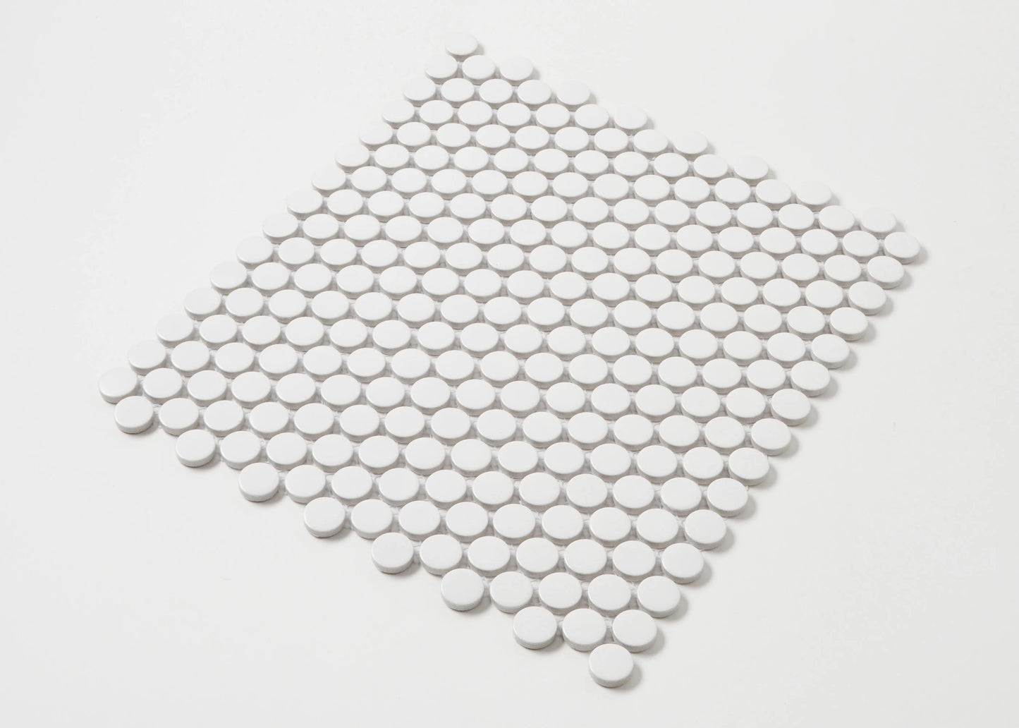 Marlowe White Matt Penny Round 19mm mosaic tile sheet displayed in a diamond orientation, showing small circular white matte ceramic tiles on a mesh backing.