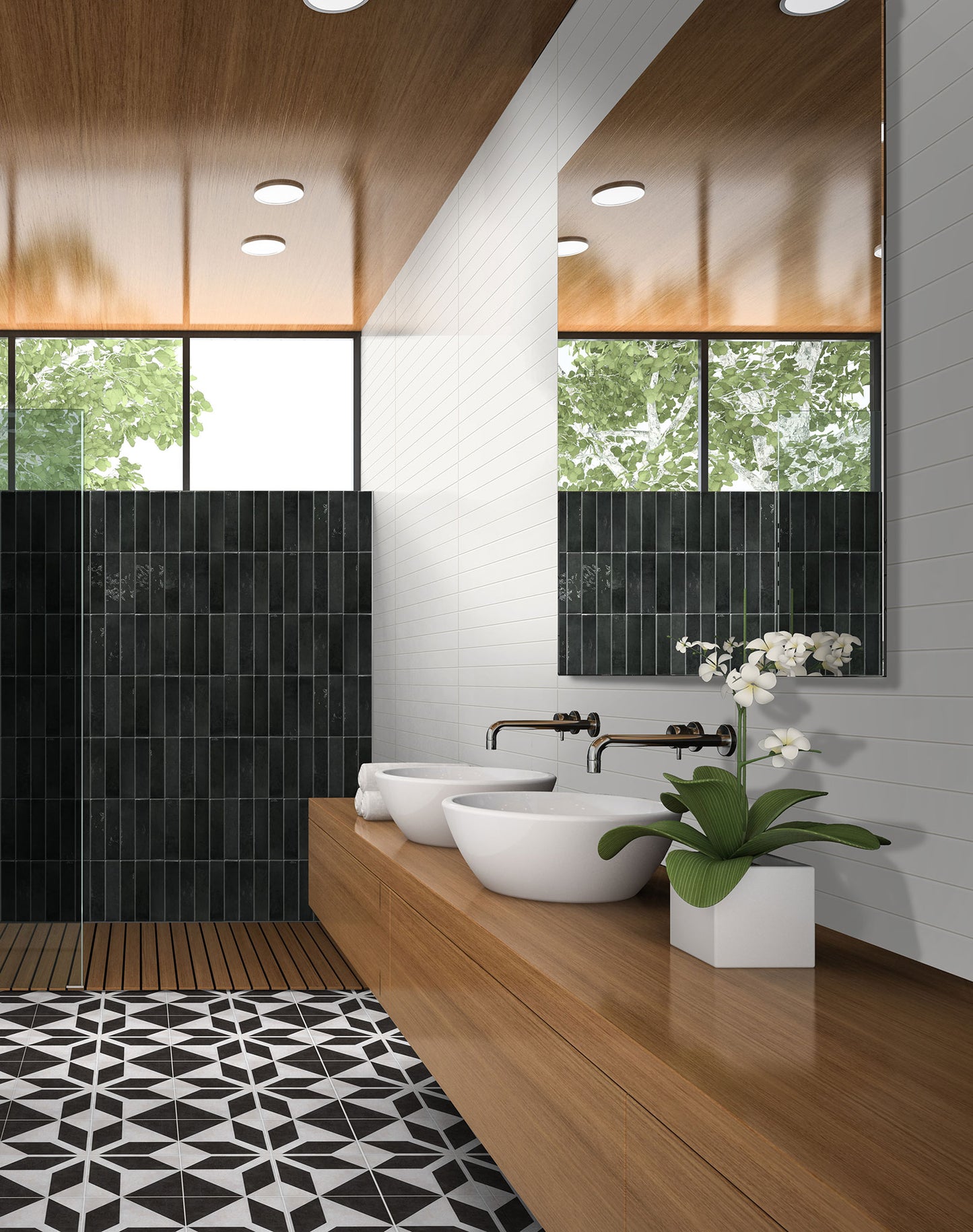 Memory Black Gloss 60x250mm tiles installed as a dramatic vertical-stacked shower wall in a modern bathroom with timber vanity and vessel sinks.