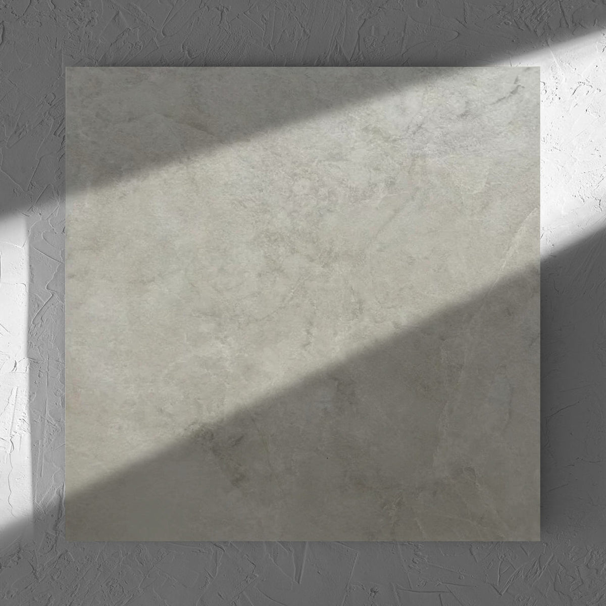 Memory Stone Beige Matt 600x600mm tile in soft natural window light, showing the tile surface