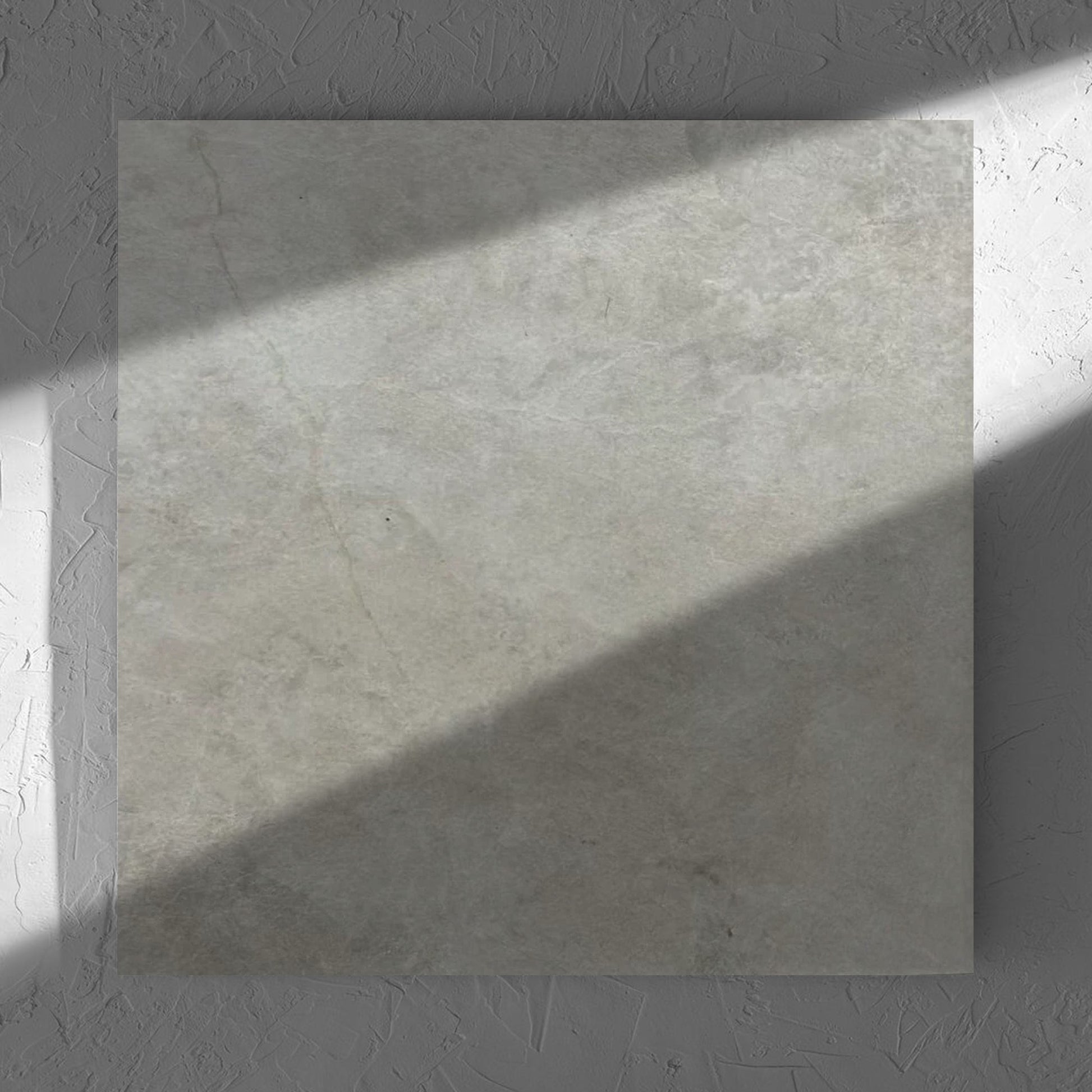 Memory Stone Bianco Matt 600x600mm tile in soft natural window light, showing the tile surface