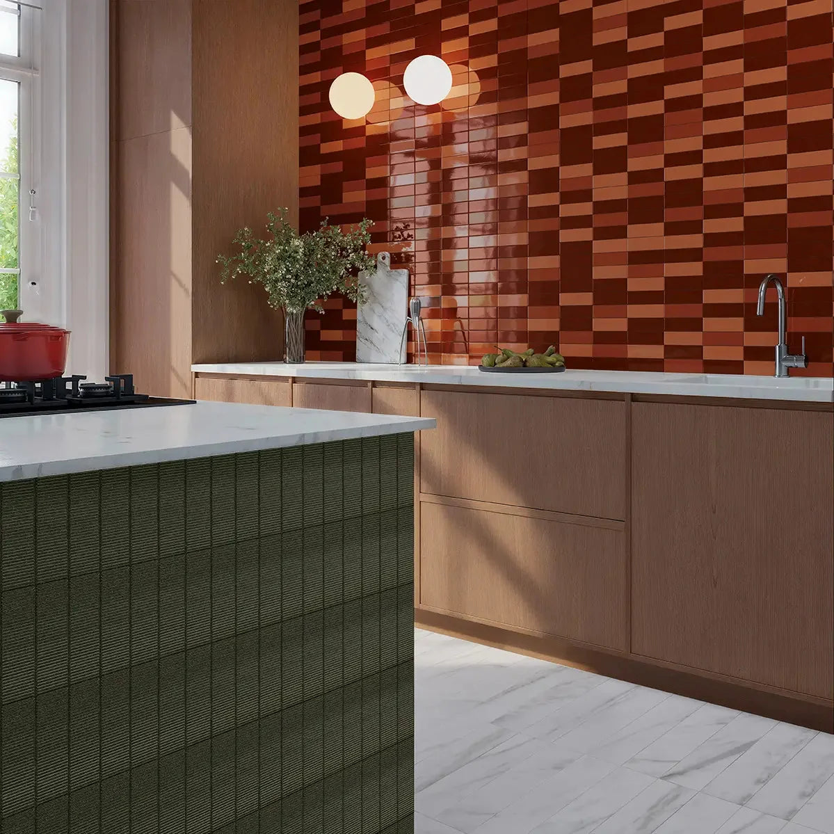 Micare Canale Evergreen Dark Gloss 50x150mm tiles cladding a kitchen island with white marble countertop, complemented by warm timber cabinetry and terracotta wall tiles.