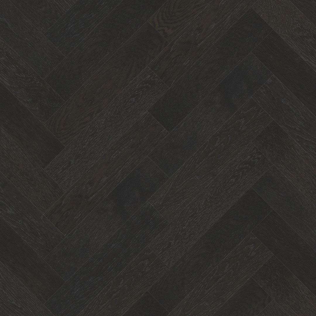 Close-up texture shot of Midnight Grey iDesign Herringbone Flooring 15/3mm showing a dark charcoal wood grain in a classic diagonal herringbone pattern.