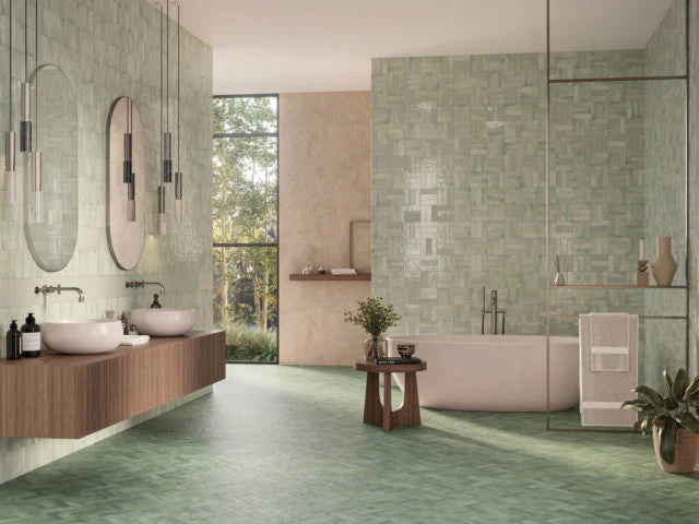 Mini Mint Glossy 50x150mm tiles covering the walls and floor of a contemporary bathroom with a floating timber vanity, freestanding bathtub, and pendant lights.