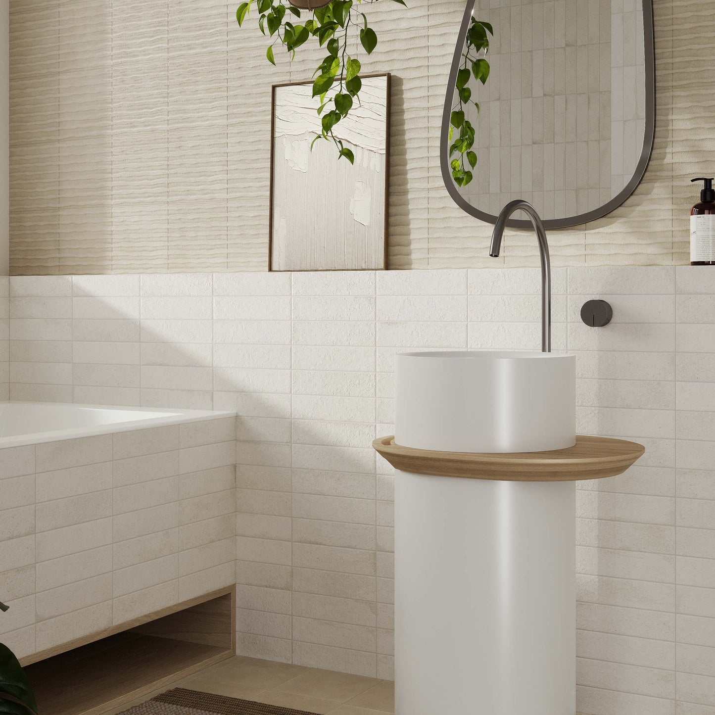 Miniature Fornace Bianco Minerale 60x240mm white textured brick tiles installed on bathroom walls alongside a freestanding pedestal basin and oval mirror.
