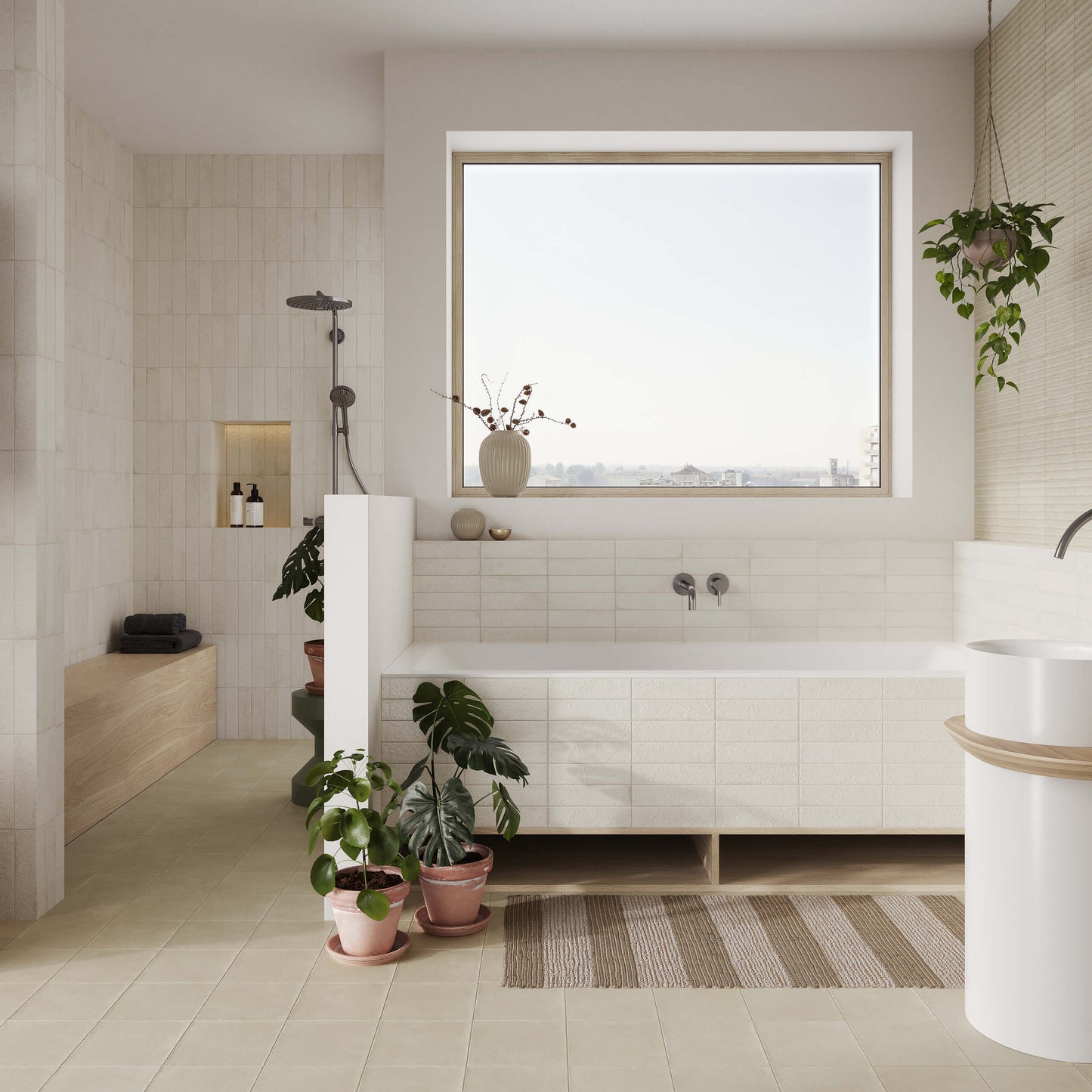 Miniature Fornace Bianco Minerale 60x240mm tiles installed in a bright spa-style bathroom featuring a freestanding bathtub, walk-in shower, and potted monstera plants.