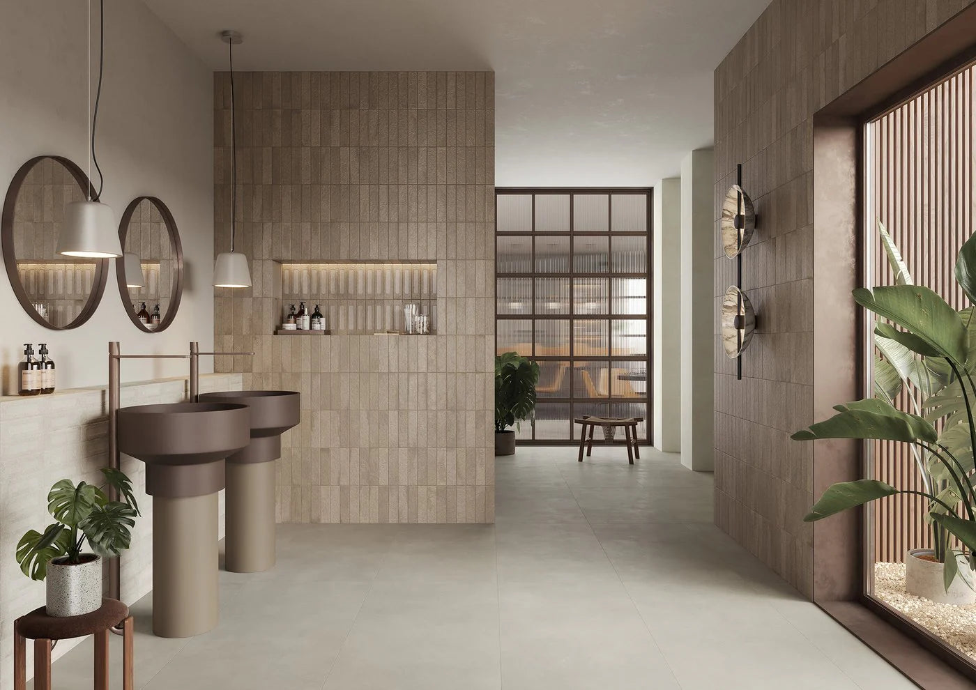 Miniature Fornace Bruno Bistro 60x240mm warm beige textured tiles covering feature walls in a contemporary spa bathroom with pedestal sinks and pendant lighting.