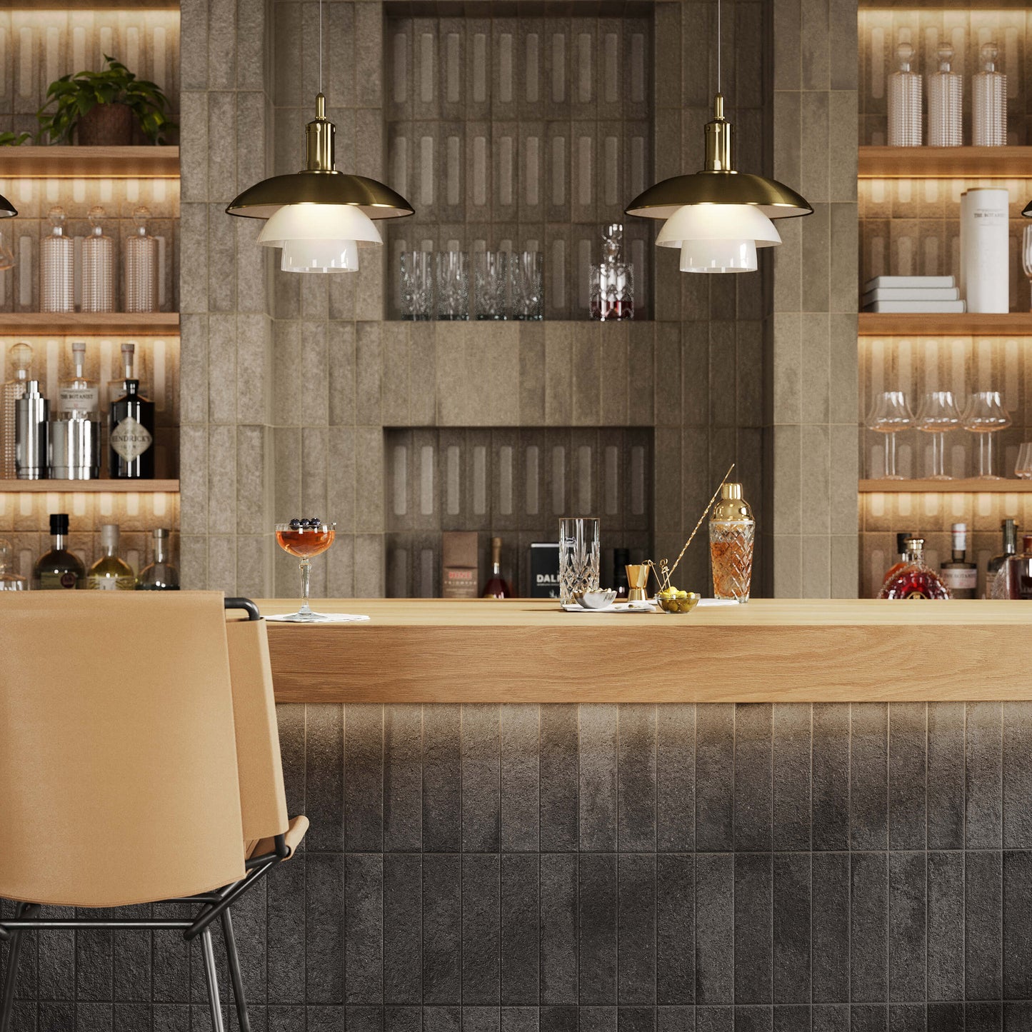 Miniature Fornace Formella Nero Fumo 60x240mm dark textured tiles cladding a cocktail bar counter and feature wall, styled with pendant lights and timber shelving.
