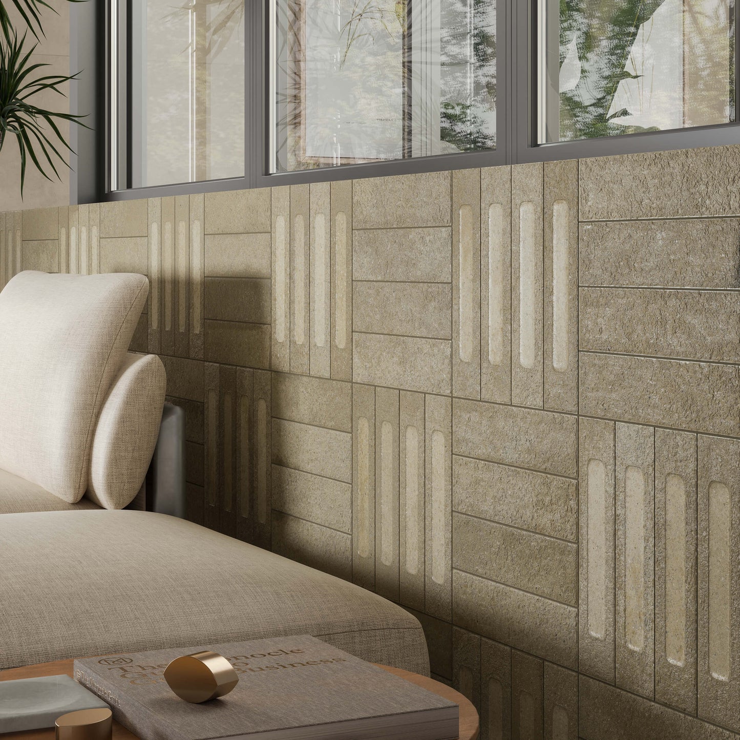 Miniature Fornace Formella Verde Muschio 60x240mm tiles installed as a textured feature wall in a modern living room with cream sofa and large windows.