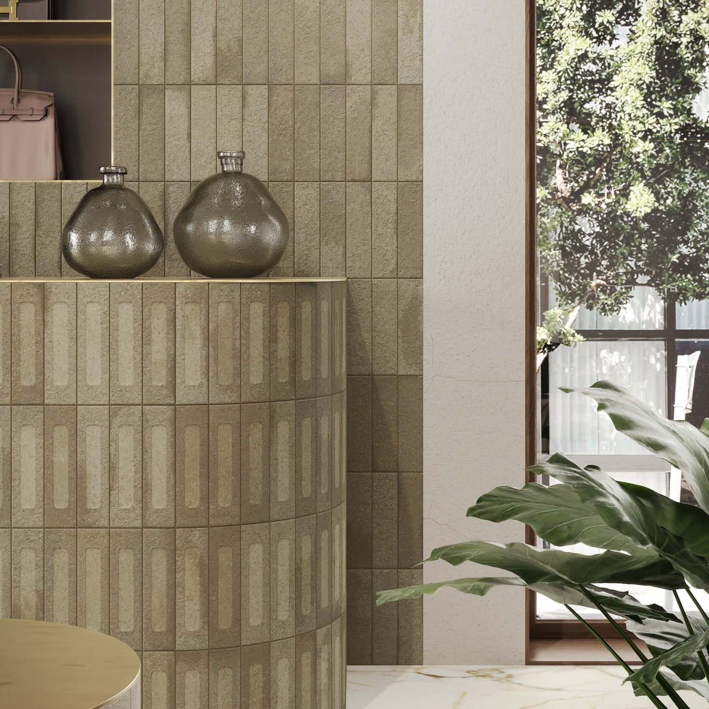 Miniature Fornace Formella Verde Muschio 60x240mm tiles installed on a curved reception counter and feature wall, styled with smoky glass vases and lush tropical plants.