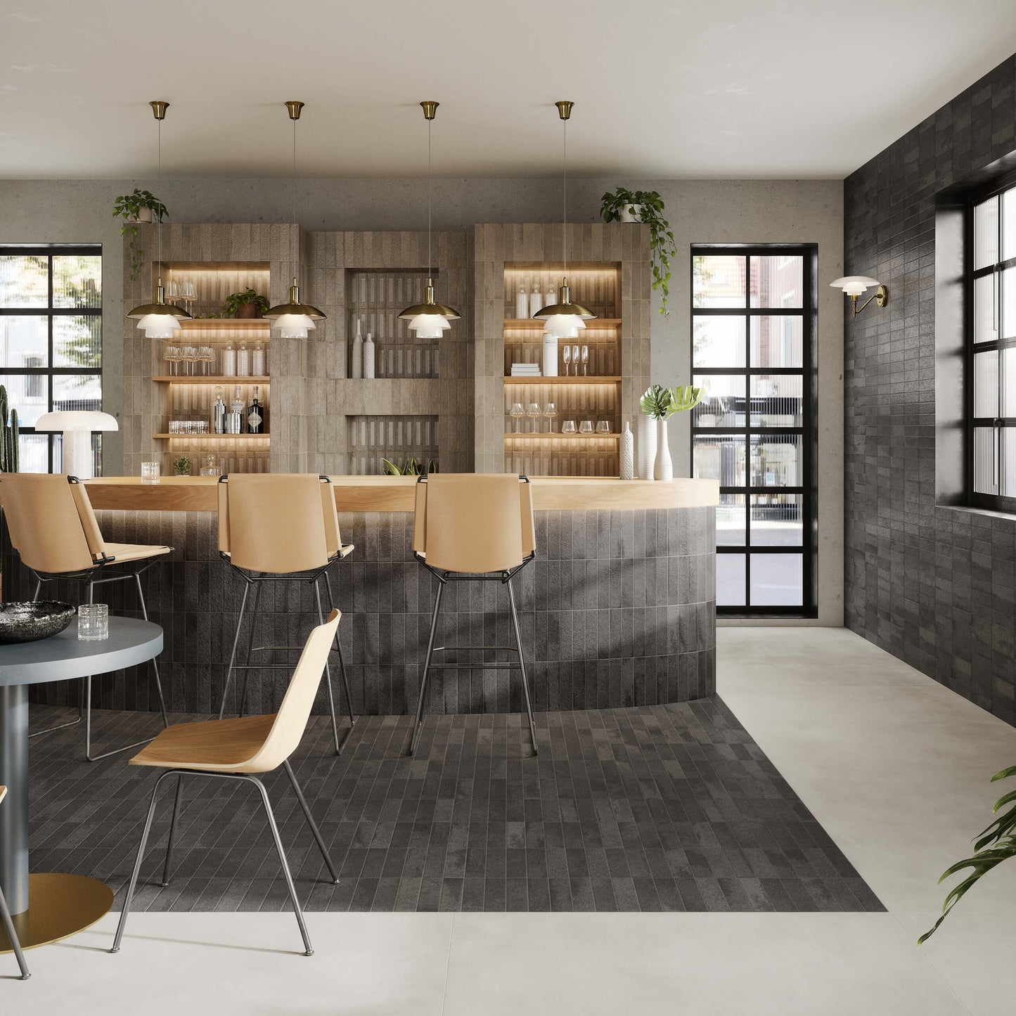 Miniature Fornace Nero Fumo 60x240mm dark charcoal tiles installed on a modern bar counter, floor, and feature wall with warm pendant lights and timber barstools.