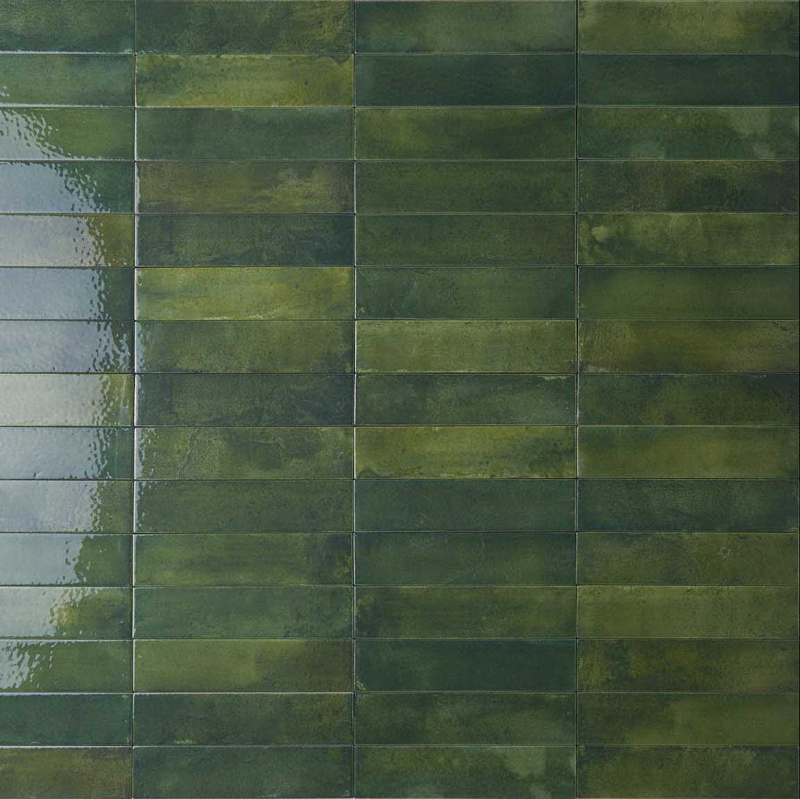 Mojave Green Brick 60x250mm ceramic wall tiles in a stacked horizontal layout with glossy, variegated deep green glaze and subtle texture variation.