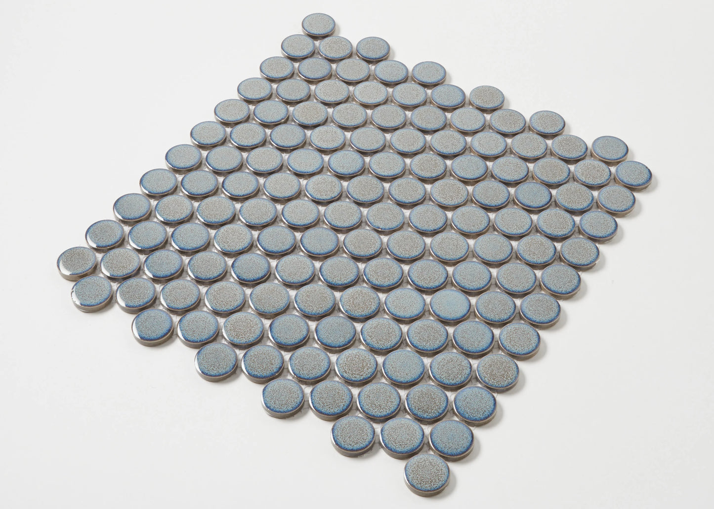 Pack shot of Mottled Grey Gloss Glazed Porcelain Penny Round 28mm Diameter tiles arranged in a diamond formation, showcasing their circular shape, speckled grey glaze, and blue-edged rims.