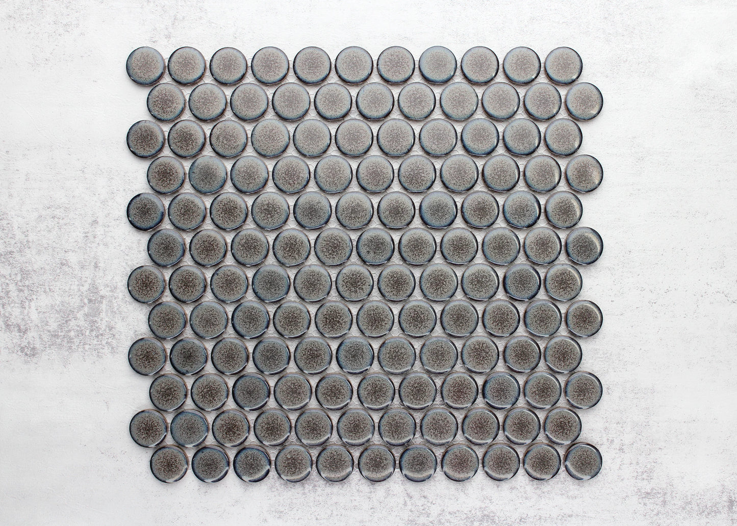 Pack shot of Mottled Grey Gloss Glazed Porcelain Penny Round 28mm Diameter tiles arranged in a full mosaic sheet, showing speckled grey gloss finish.
