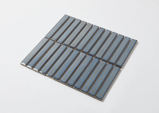Pack shot of Mottled Grey Gloss KitKat Straight Bone Pattern 22x145mm tiles arranged in a staggered vertical layout with a glossy blue-grey glaze finish.