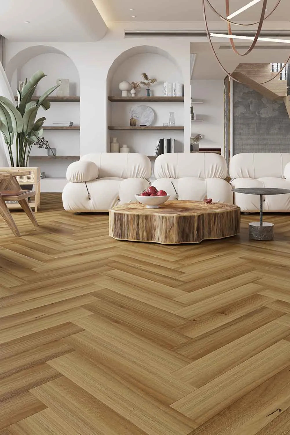 Natural Spotted Gum Elegant SPC Hybrid Herringbone 9.5mm Flooring 7.5+2mm installed in a modern living room with white bouclé sofas and a raw timber coffee table.