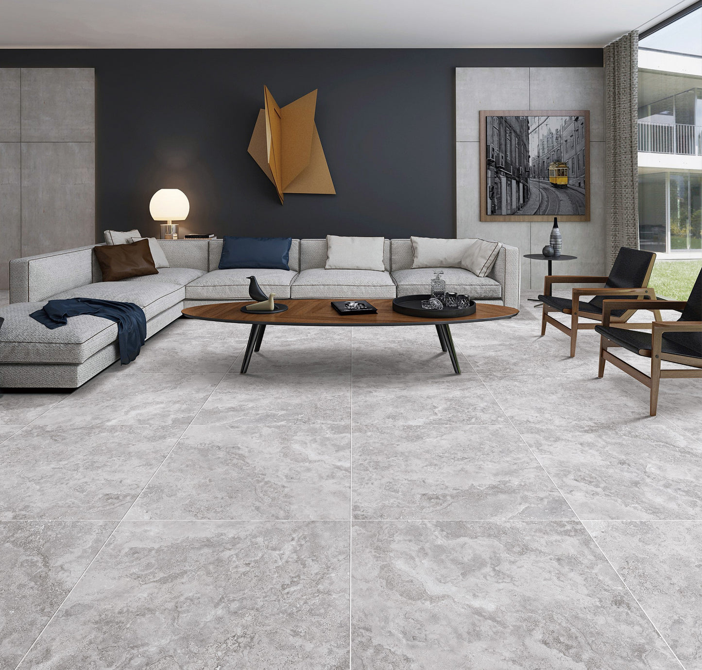 New Travertino Grey Matt Rectified 600X600mm floor tiles installed in a contemporary living room with a grey sectional sofa and walnut coffee table.