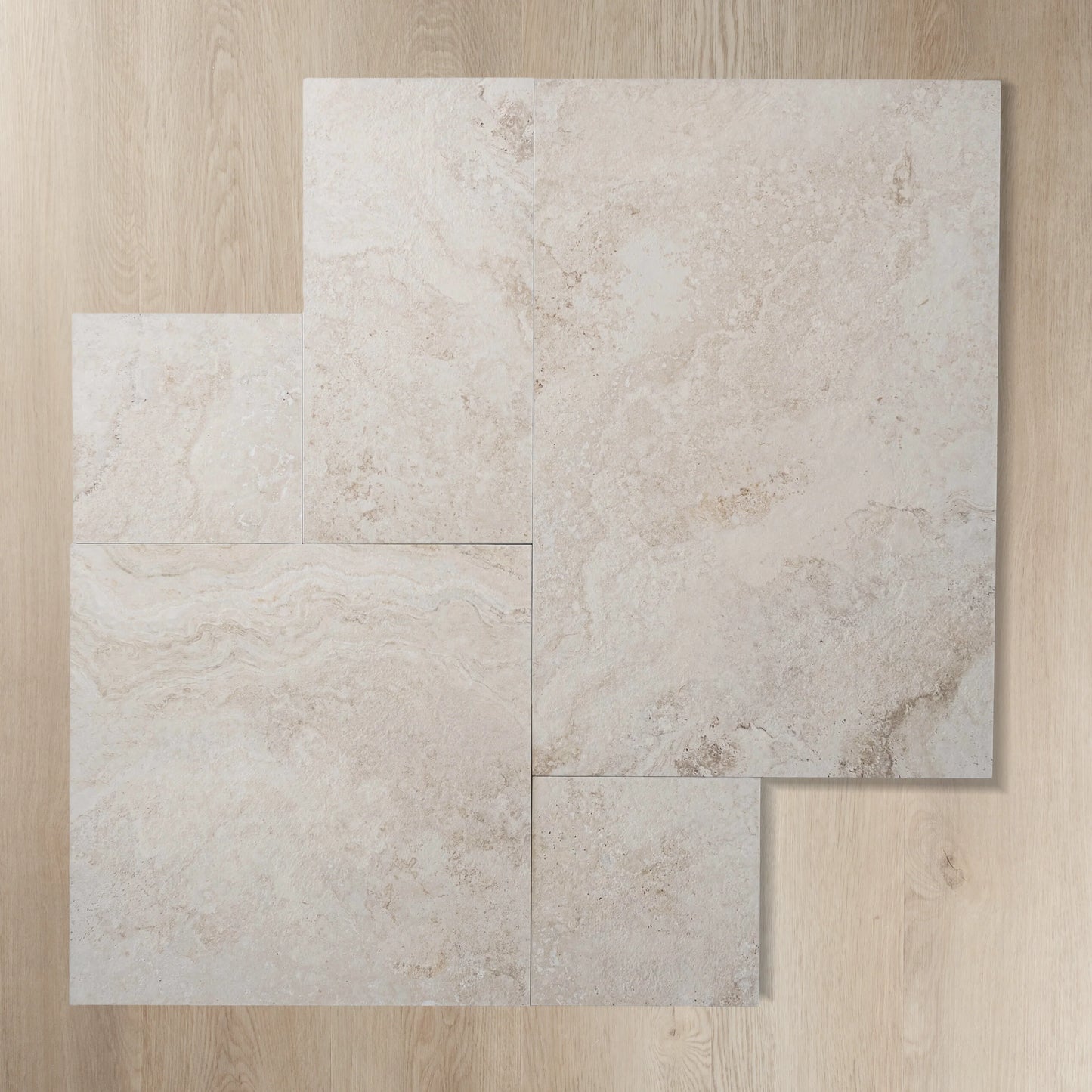 Four tiles of Norcia Beige French Pattern 400x600mm displayed in a staggered layout showing the natural stone-look texture and warm cream tones.