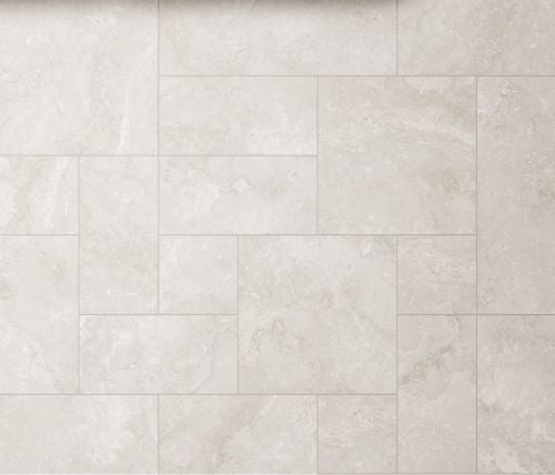 Norcia Light French Pattern 400x600mm porcelain tiles arranged in a staggered brick layout, showcasing a soft white and beige marble-look finish with subtle veining.