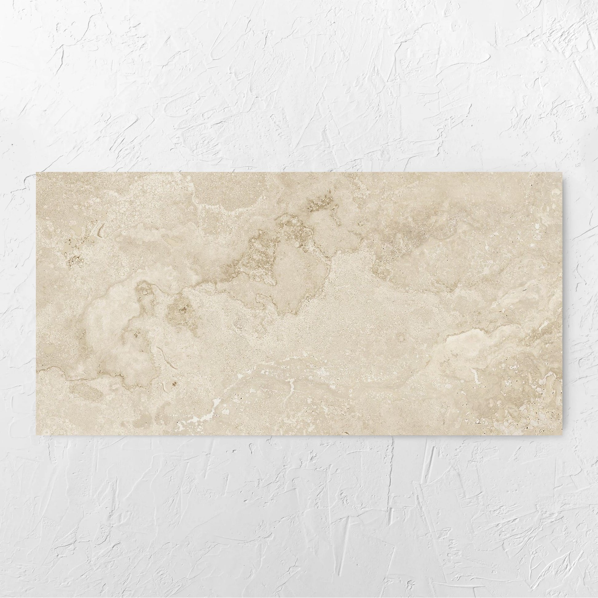 Norcia Travertine Beige 600x1200mm tile laid flat on a white rendered wall, showing the tile surface