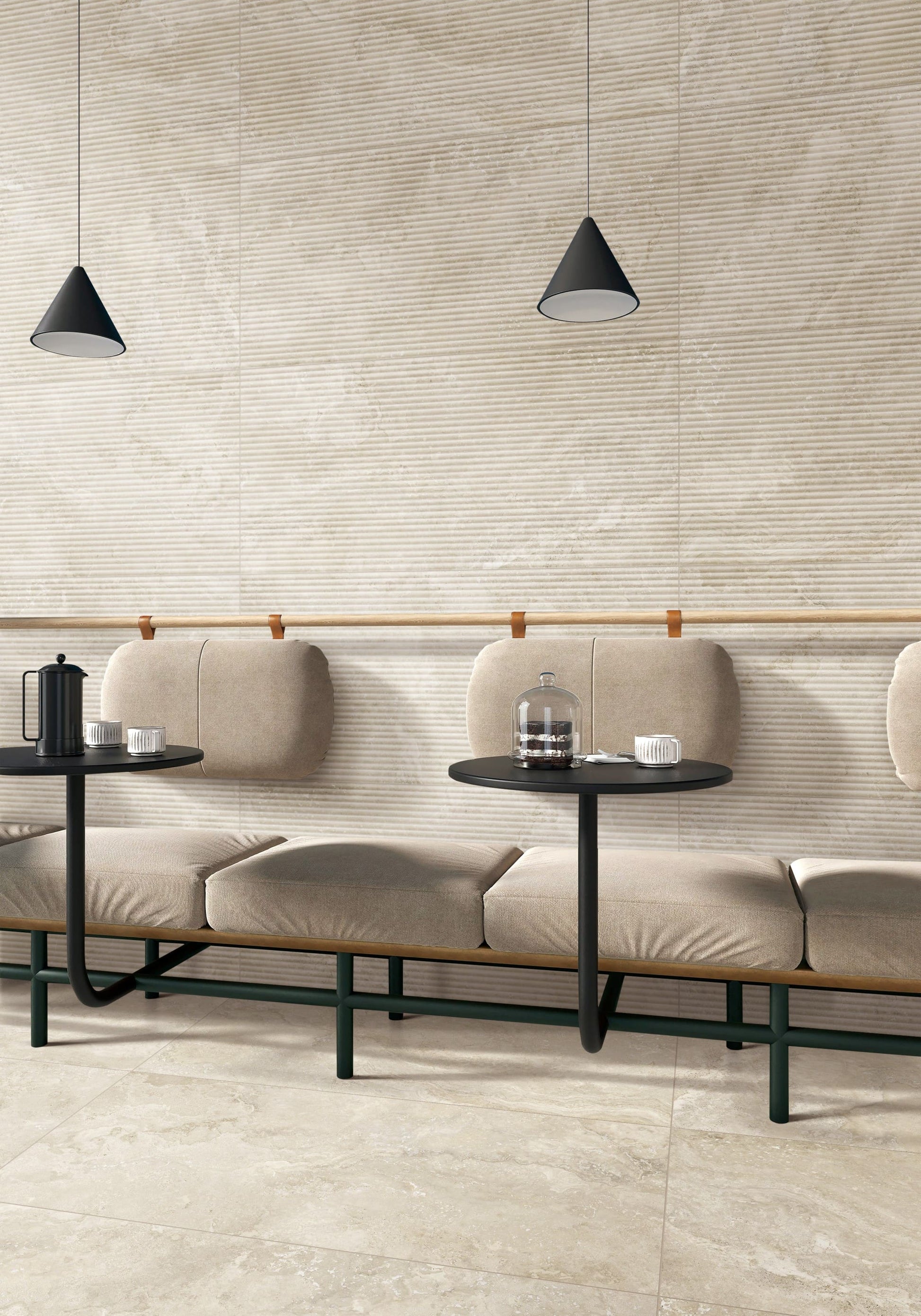 Norcia Travertine Beige Bamboo Feature 600x1200mm tiles installed on a cafe wall behind a modular upholstered bench seat with black pendant lights.