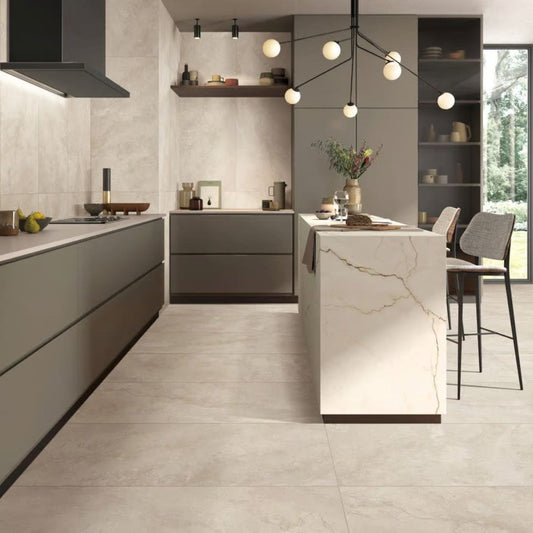 Norcia Travertine Beige Bamboo Feature 600x1200mm tiles installed as large-format floor and wall in a modern kitchen with marble island and pendant lighting.