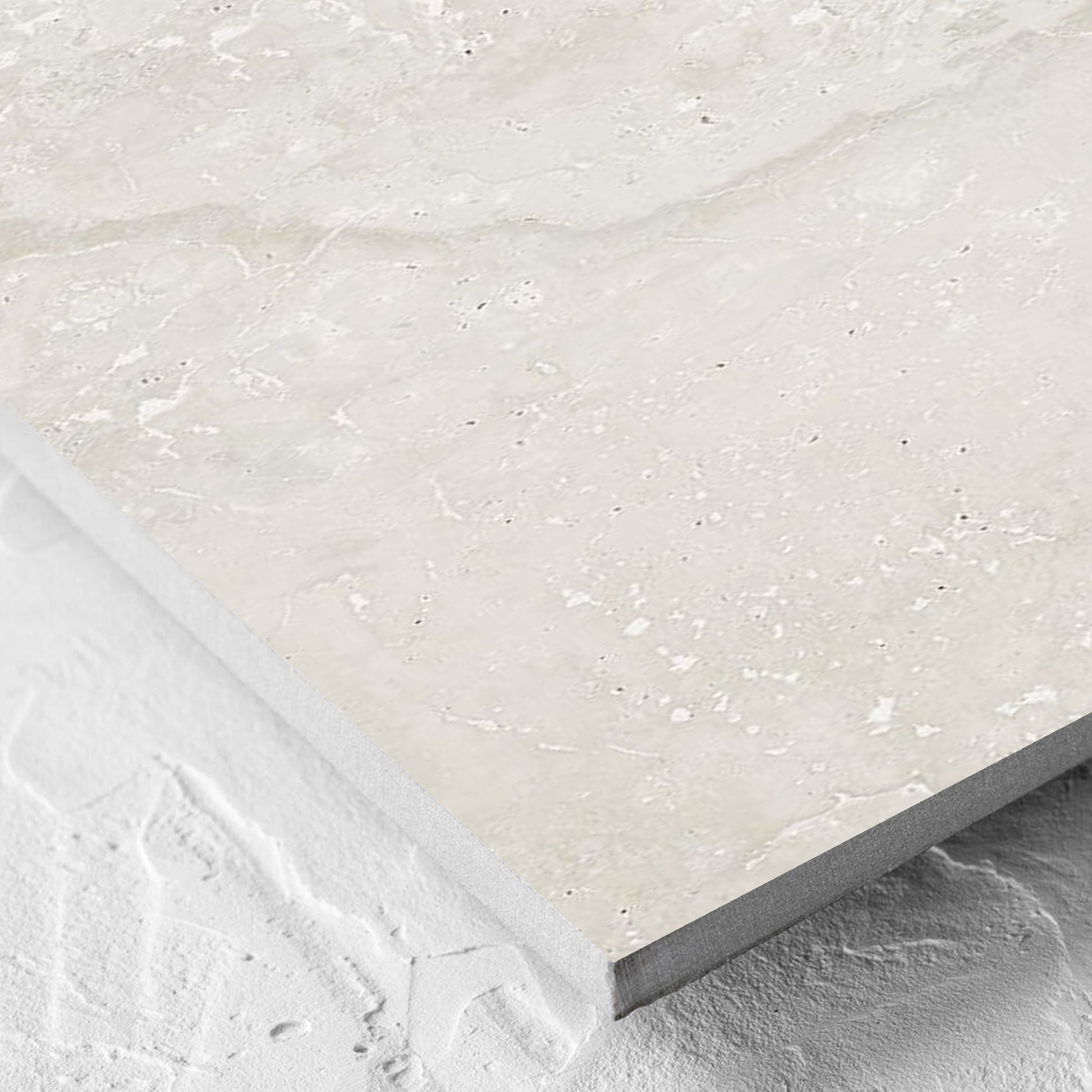 Corner close-up of the Norcia Travertine Light 300x600mm tile showing the tile surface and the edge profile