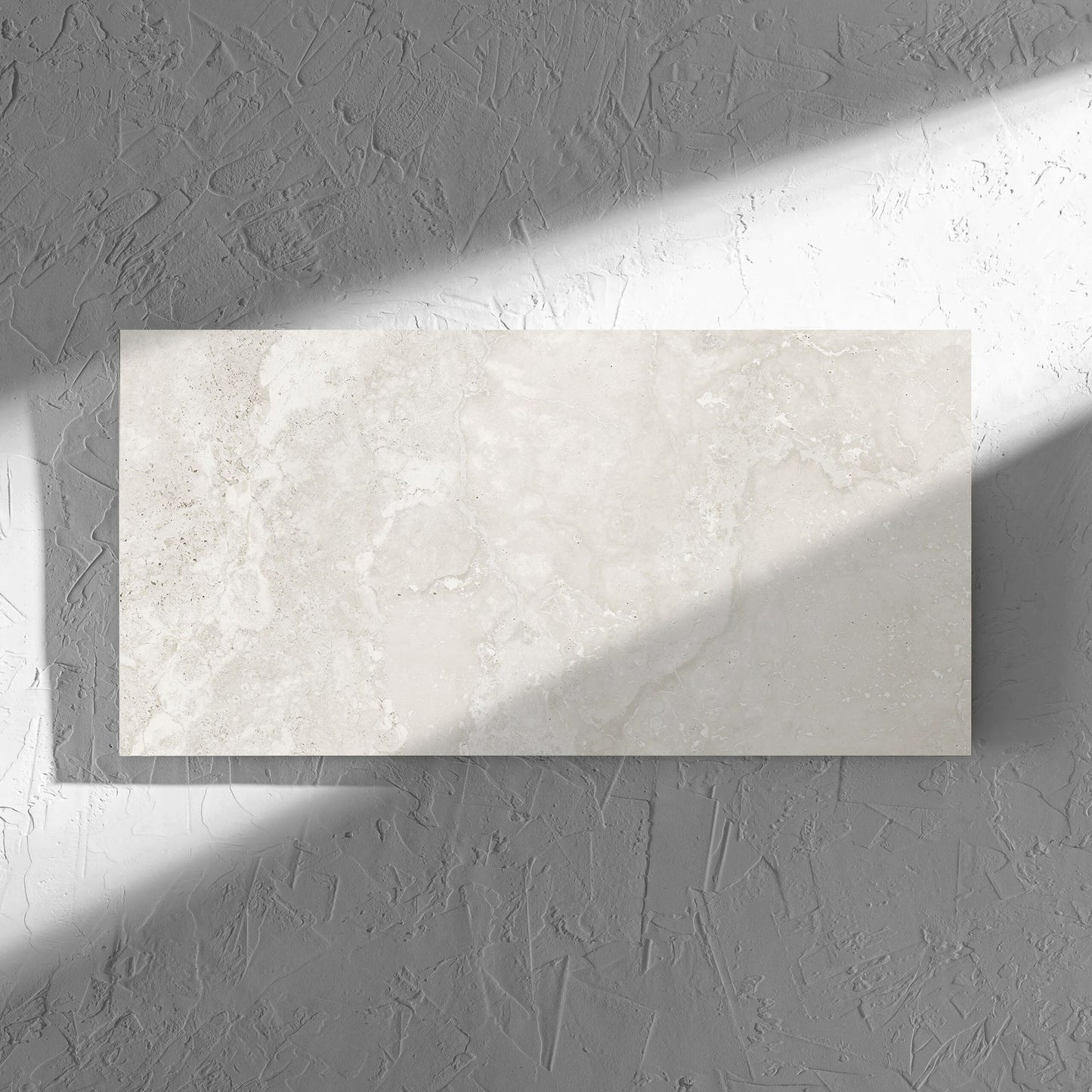 Norcia Travertine Light 300x600mm tile in soft natural window light, showing the tile surface