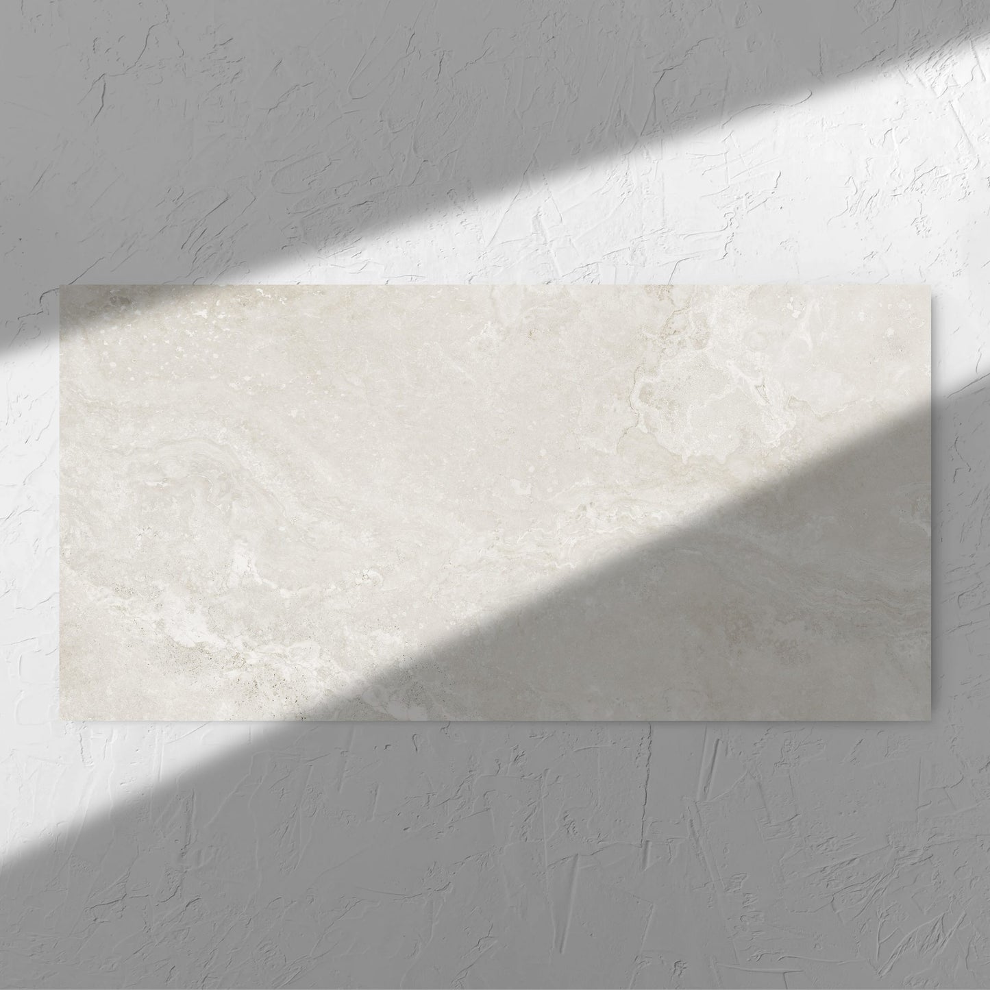 Norcia Travertine Light 600x1200mm tile in soft natural window light, showing the tile surface