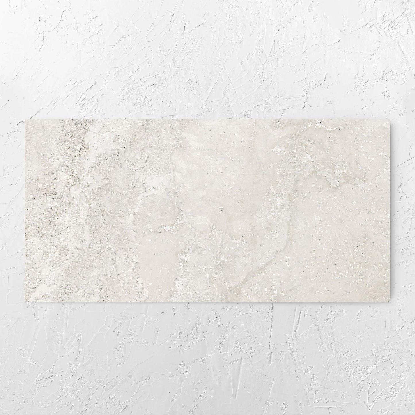 Norcia Travertine Light Bamboo Feature 600x1200mm tile laid flat on a white rendered wall, showing the tile surface