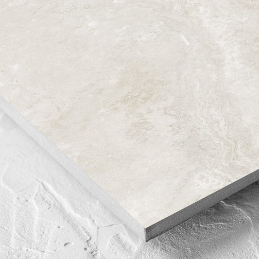 Corner close-up of the Norcia Travertine Light Decor 300x600mm tile showing the tile surface and the edge profile
