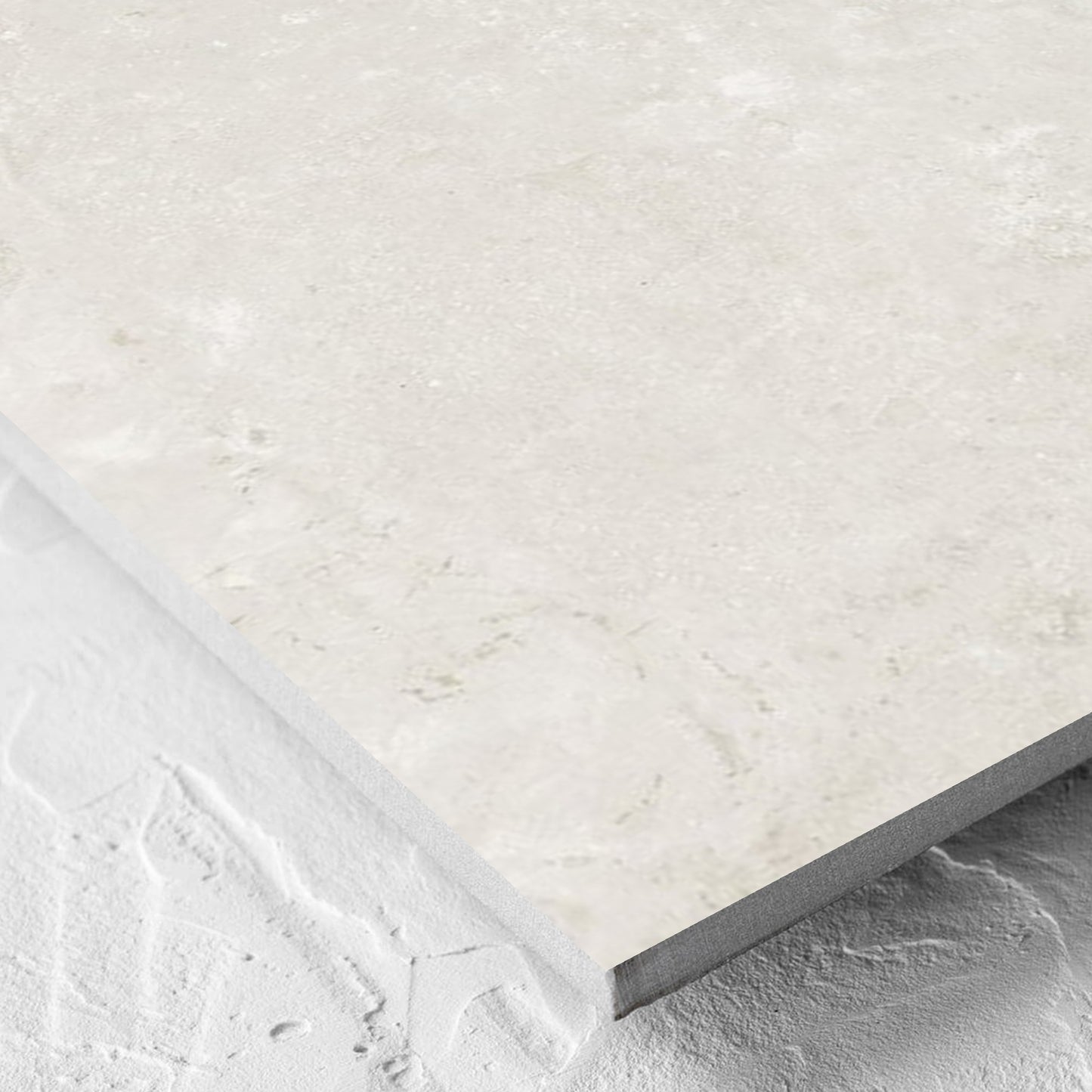Corner close-up of the Norcia Travertine Light Honed 600x600mm tile showing the tile surface and the edge profile