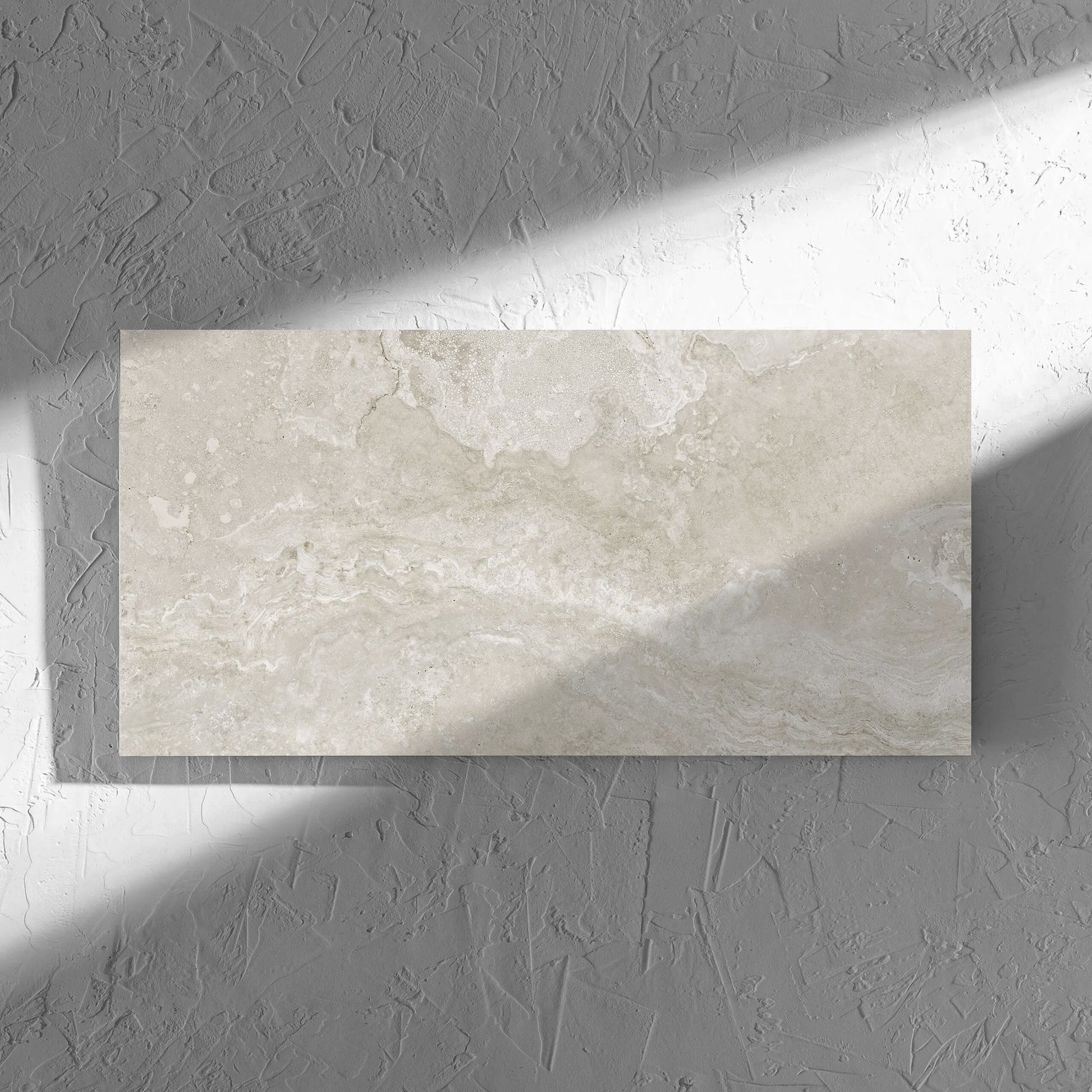 Norcia Travertine Silver 300x600mm tile in soft natural window light, showing the tile surface