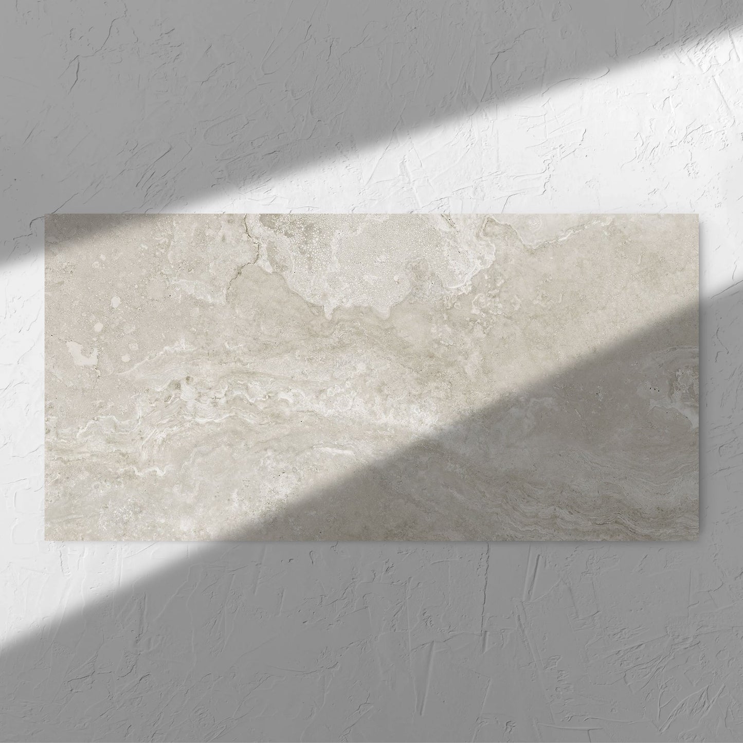 Norcia Travertine Silver 600x1200mm tile in soft natural window light, showing the tile surface