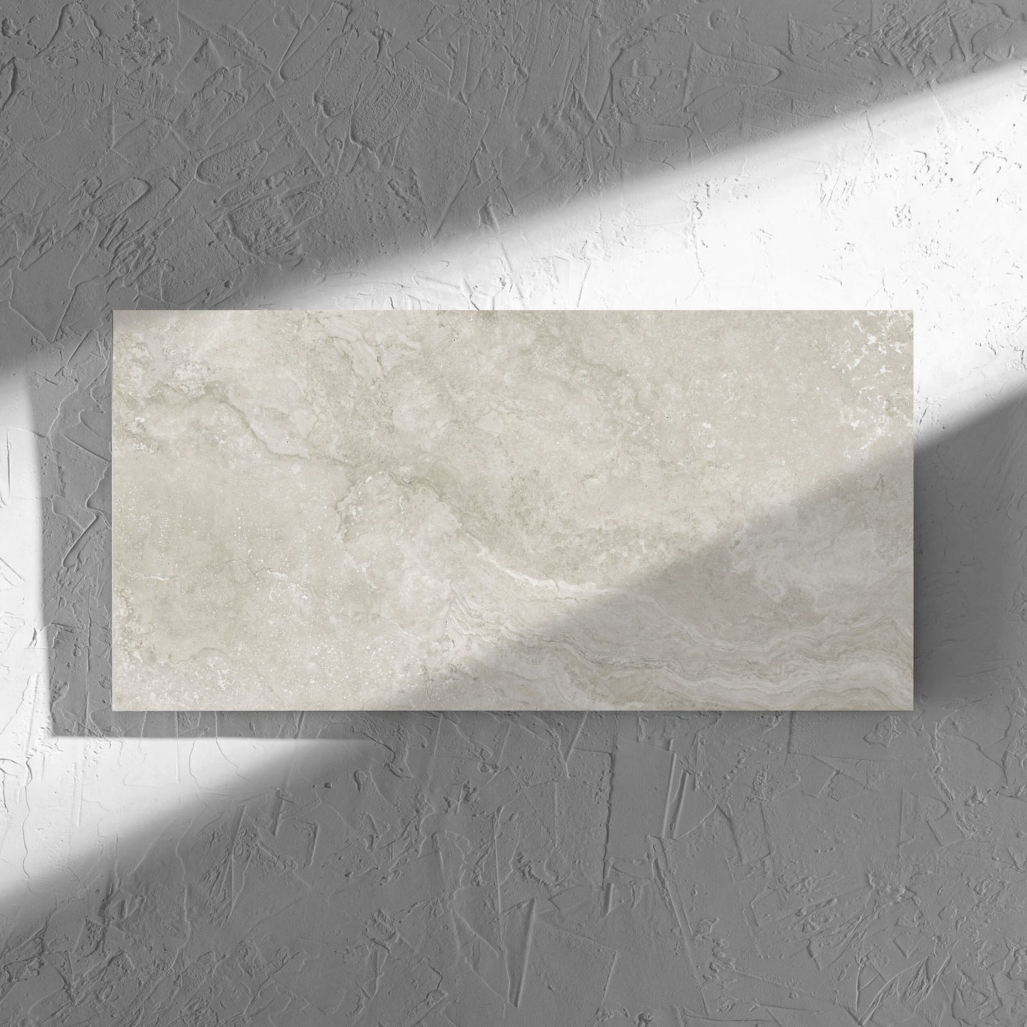 Norcia Travertine Silver Decor 300x600mm tile in soft natural window light, showing the tile surface