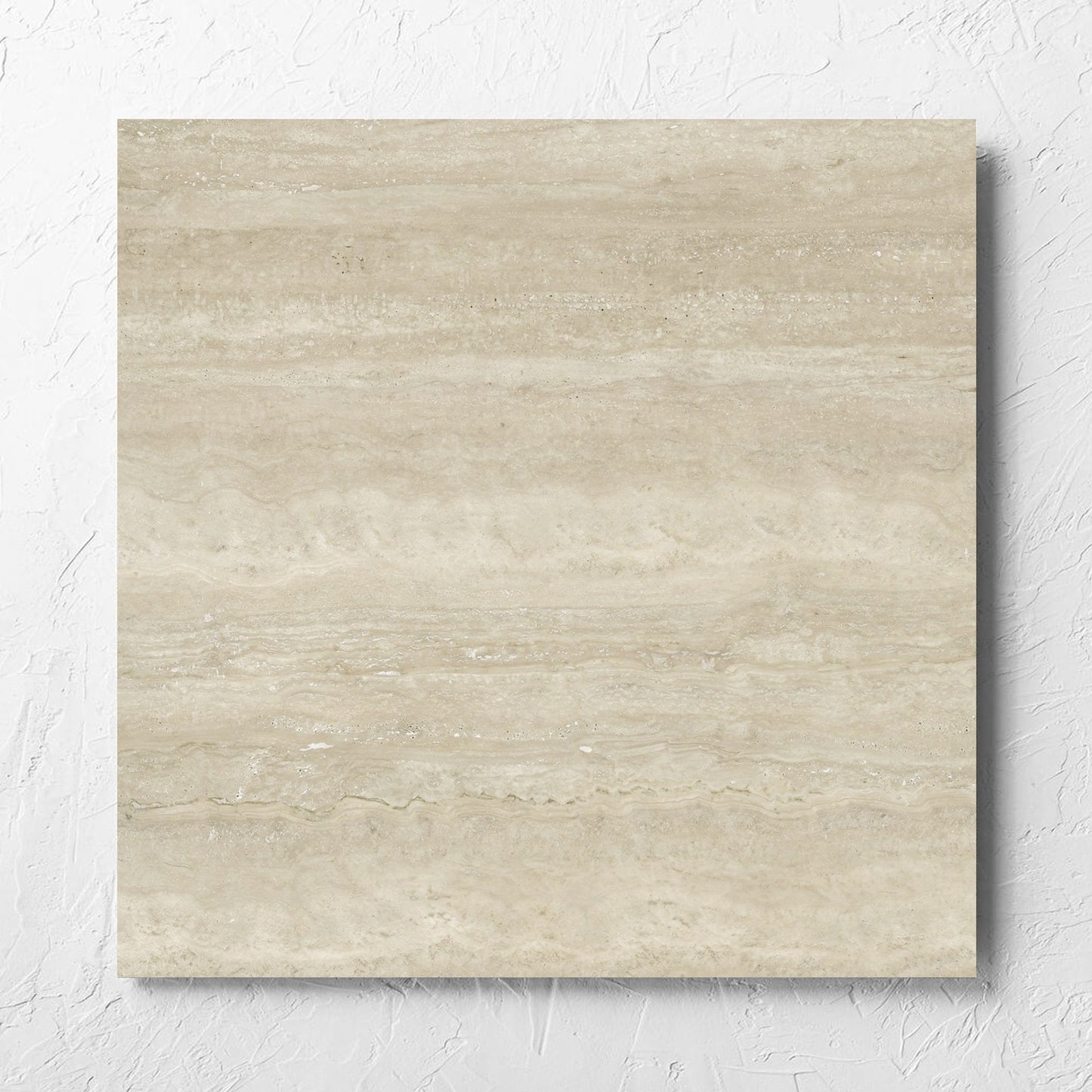 Norcia Vein Cut Beige 600x600mm tile laid flat on a white rendered wall, showing the beige matt surface