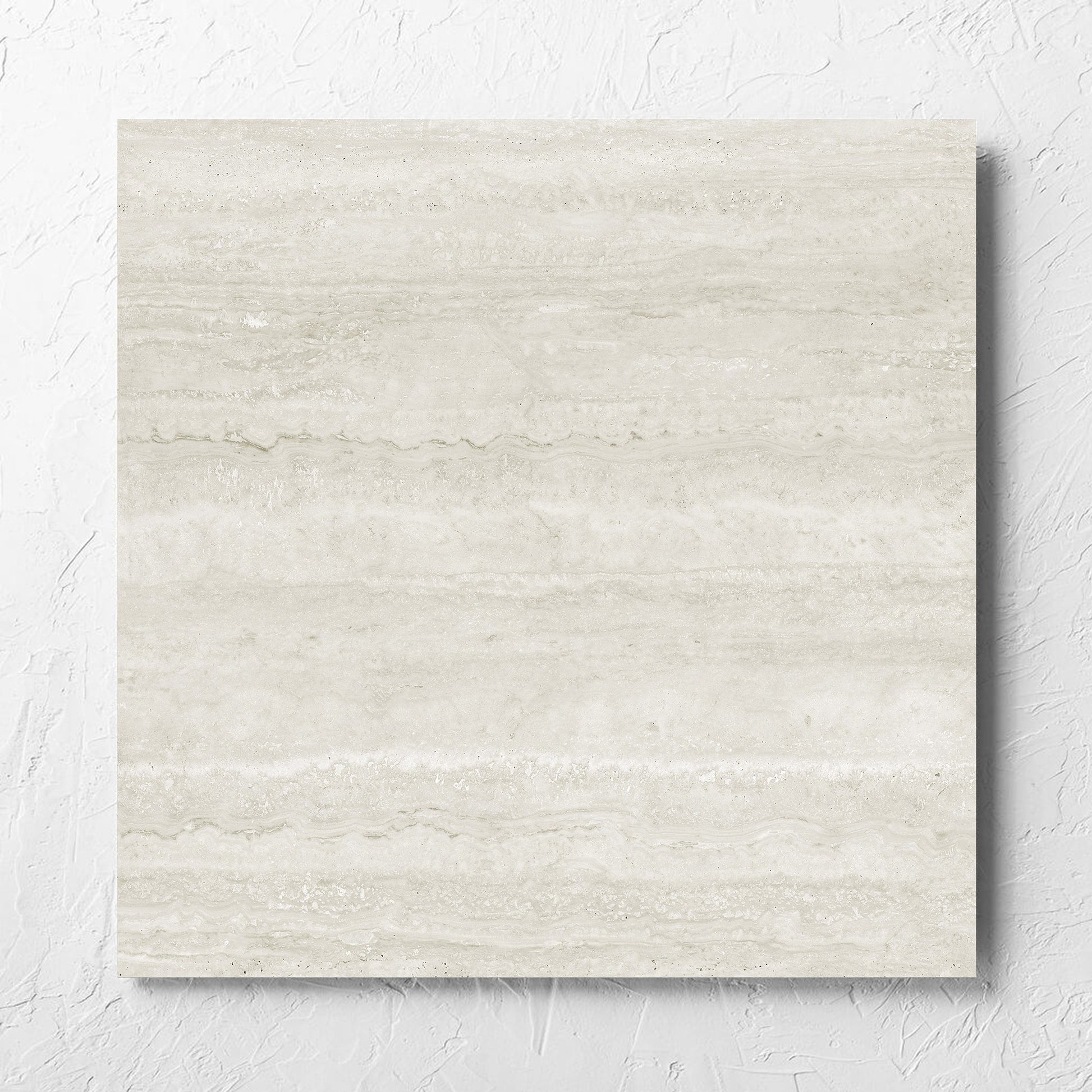 Norcia Vein Cut Light 600x600mm tile laid flat on a white rendered wall, showing the light grey matt surface