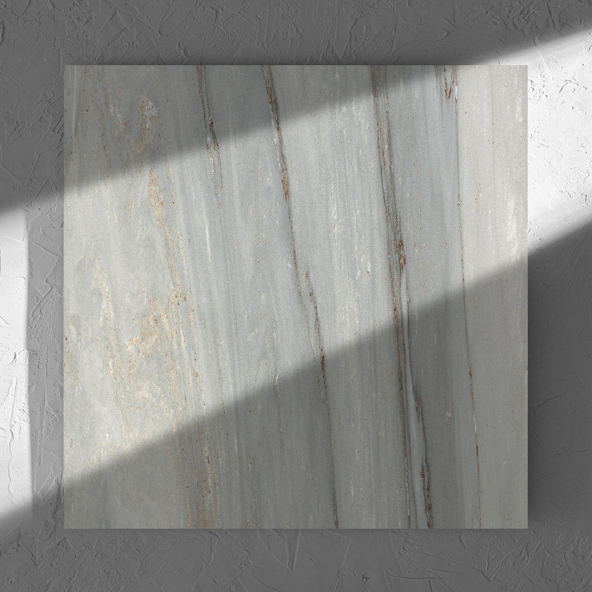 Nuovi Marmi Palissandro Lappato 600x600mm tile in soft natural window light, showing the matt surface