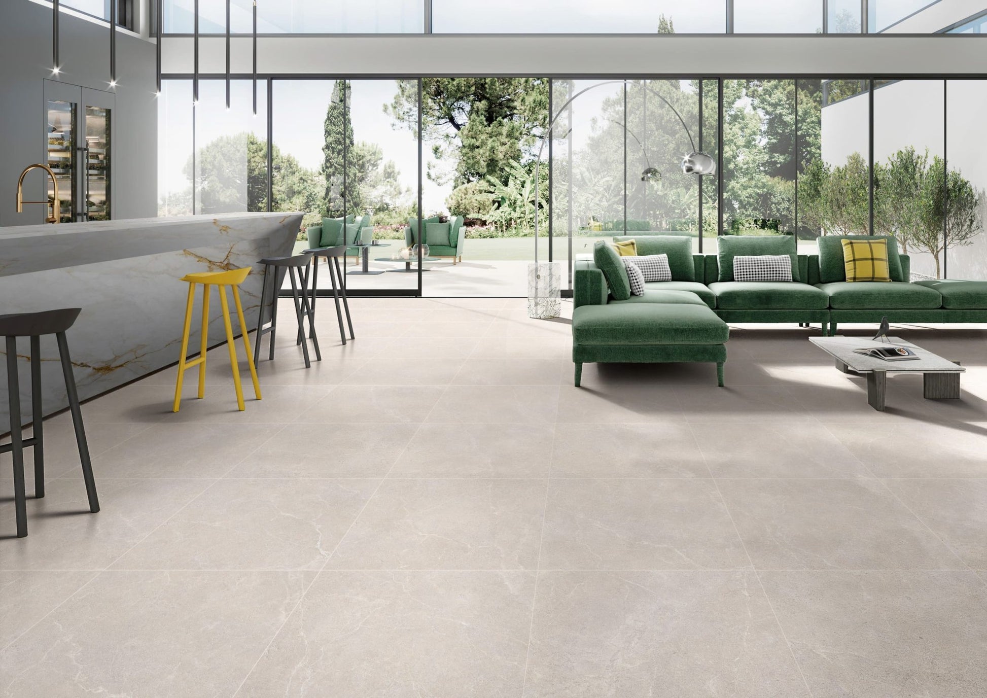 Oglio Beige Lappato 600x600mm tiles installed across an open-plan living and kitchen space featuring a green sectional sofa and marble island.