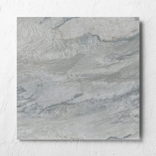 Onyx Grey Polished 600x600mm tile laid flat on a white rendered wall, showing the matt surface