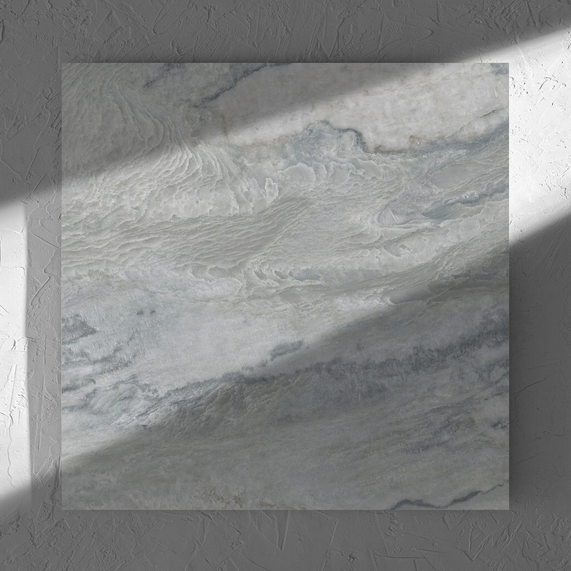 Onyx Grey Polished 600x600mm tile in soft natural window light, showing the matt surface
