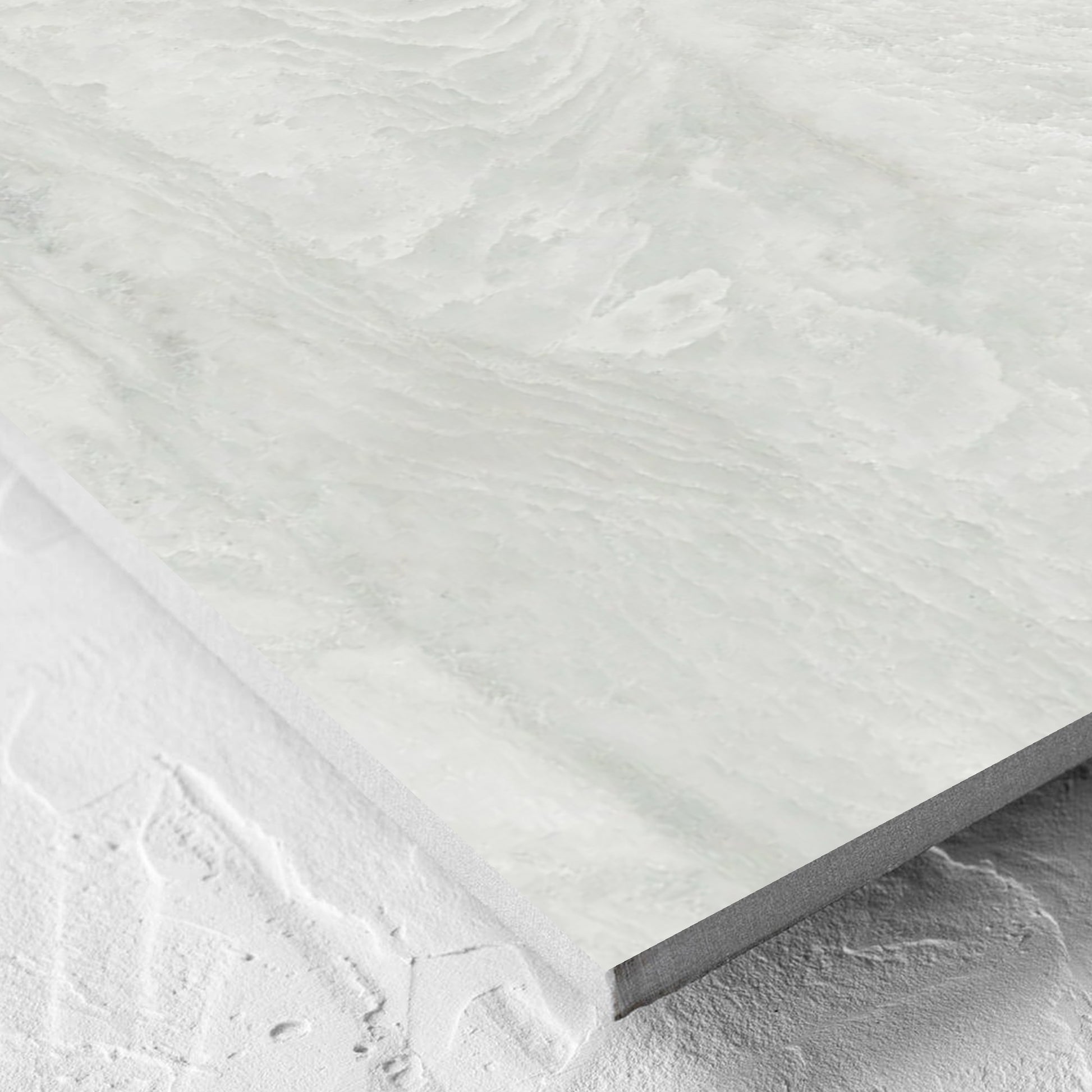Corner close-up of the Onyx White Matt 600x600mm tile showing the matt surface and the edge profile
