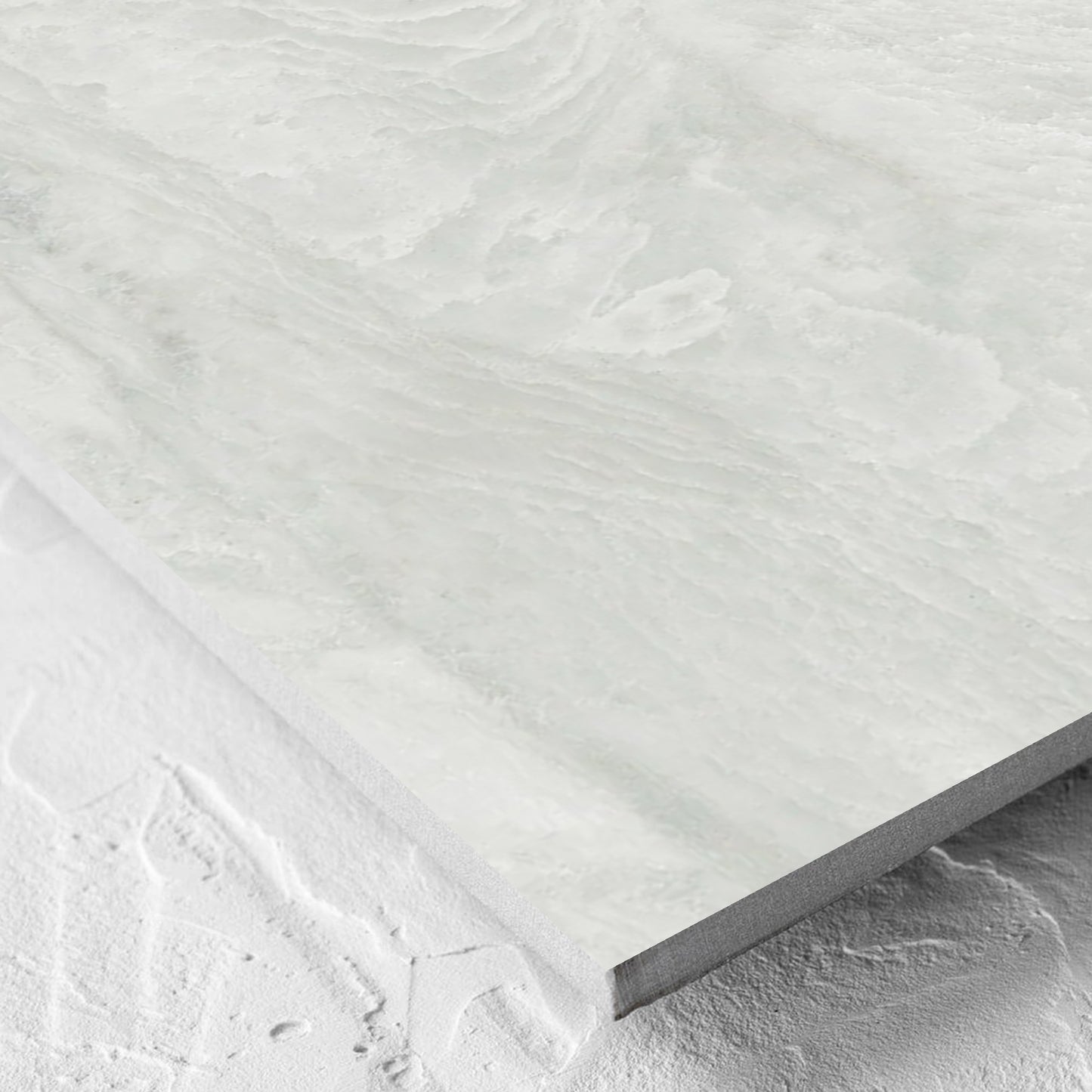 Corner close-up of the Onyx White Polished 600x600mm tile showing the matt surface and the edge profile