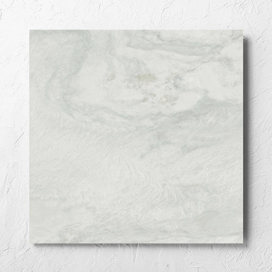 Onyx White Polished 600x600mm tile laid flat on a white rendered wall, showing the matt surface