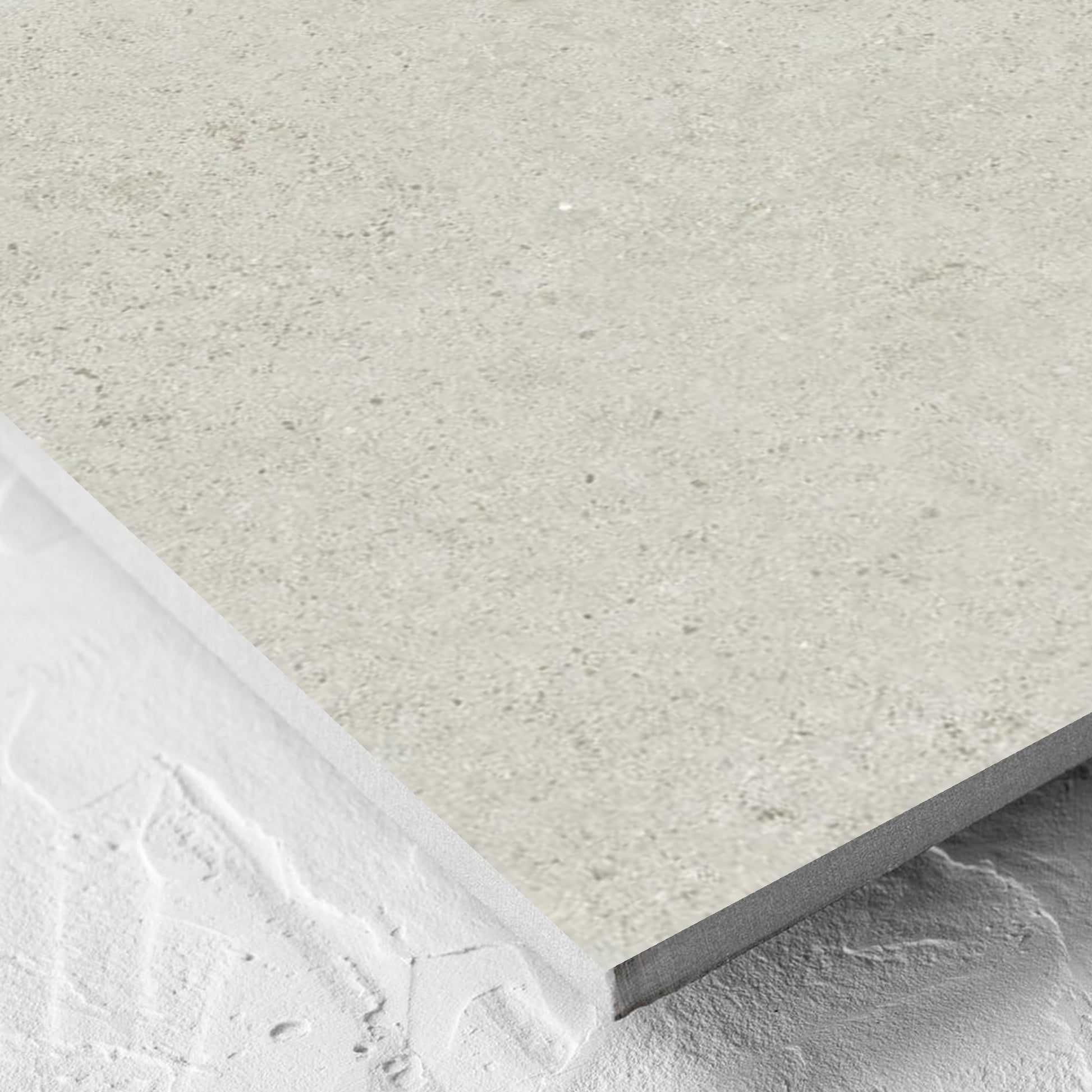 Corner close-up of the Organic Pietra Lavica Birch 600x600mm tile showing the tile surface and the edge profile