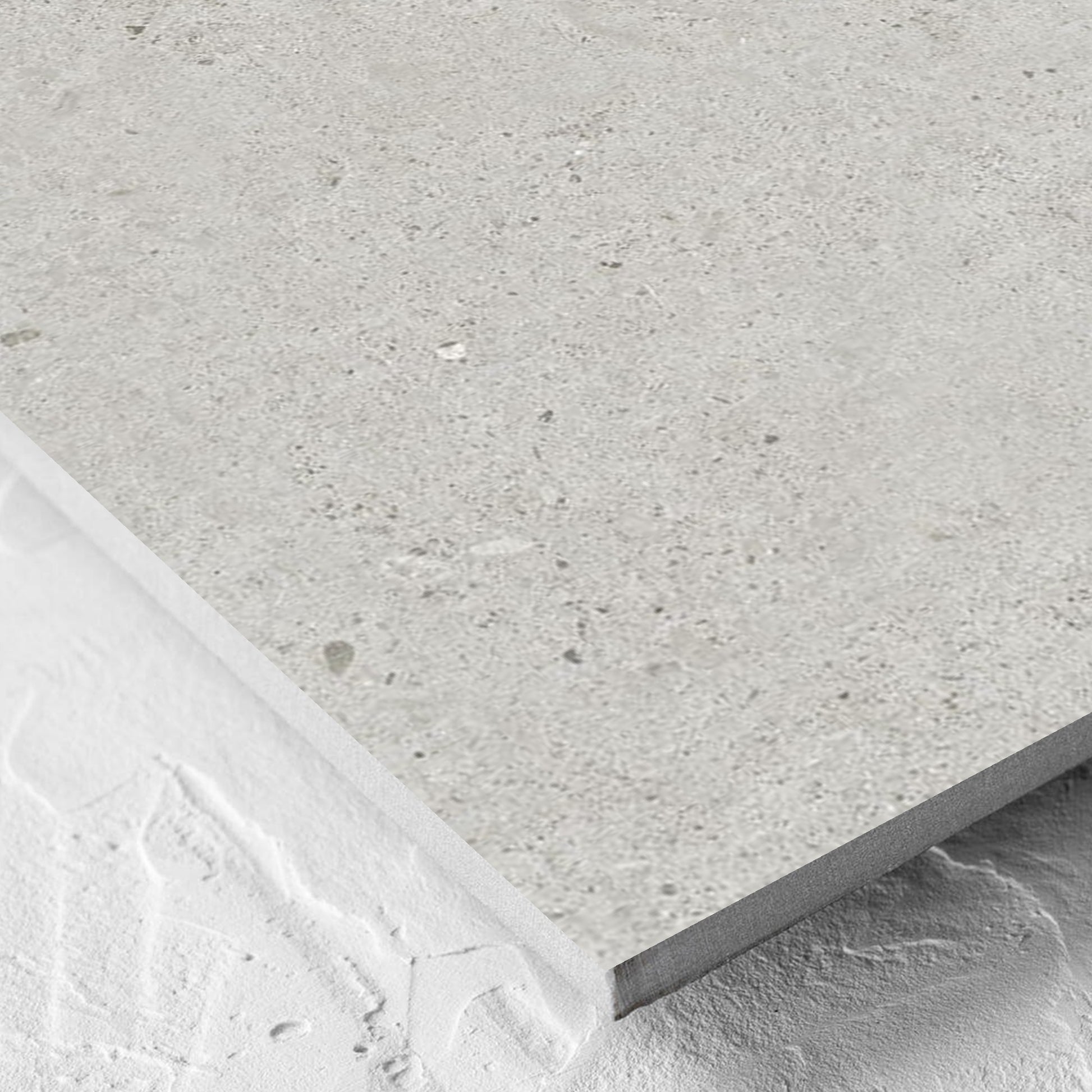 Corner close-up of the Organic Pietra Lavica Glacier Lappato 600x600mm tile showing the tile surface and the edge profile