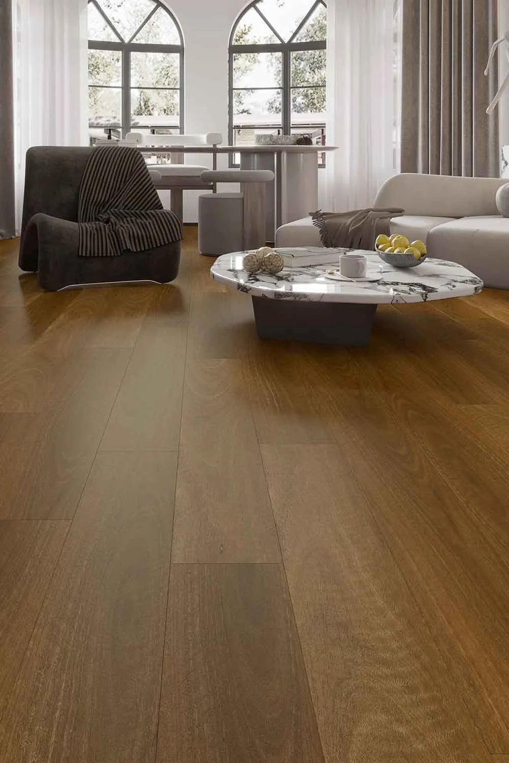 Pacific Spotted Gum Elegant SPC Hybrid 9.5mm Flooring 7.5+2mm installed in a bright modern living room with a marble coffee table and arched windows.